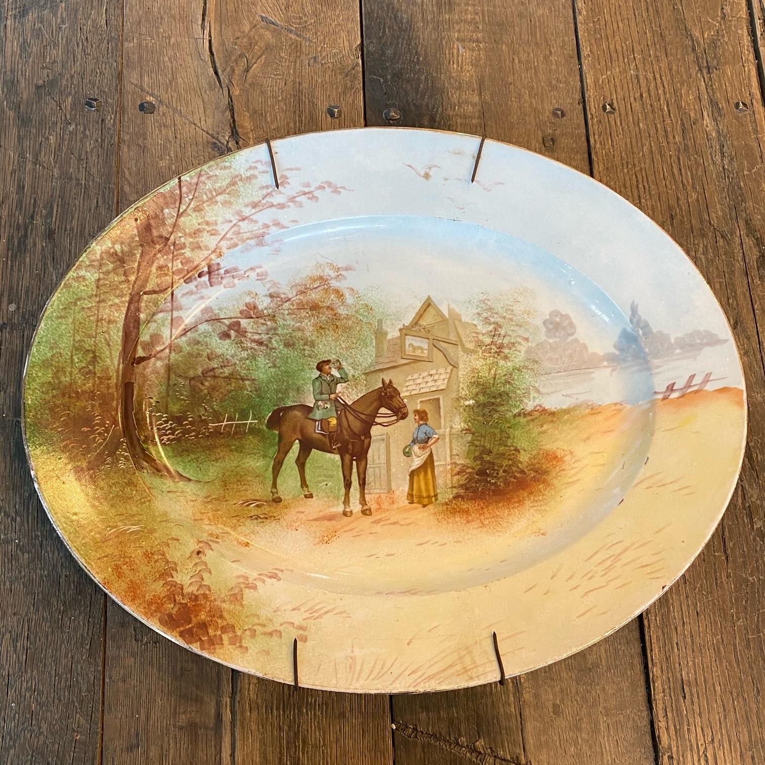 Beautiful pair of antique Limoges, France hunting equestrian hand painted platters that can be hung on a wall or used in entertaining. Original wall hanging wires remain and can be easily removed. Marked PL Limoges, France on the back. Excellent