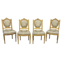 Excelente juego de cuatro sillones de salón de madera dorada estilo Luis XVI de principios del siglo XX