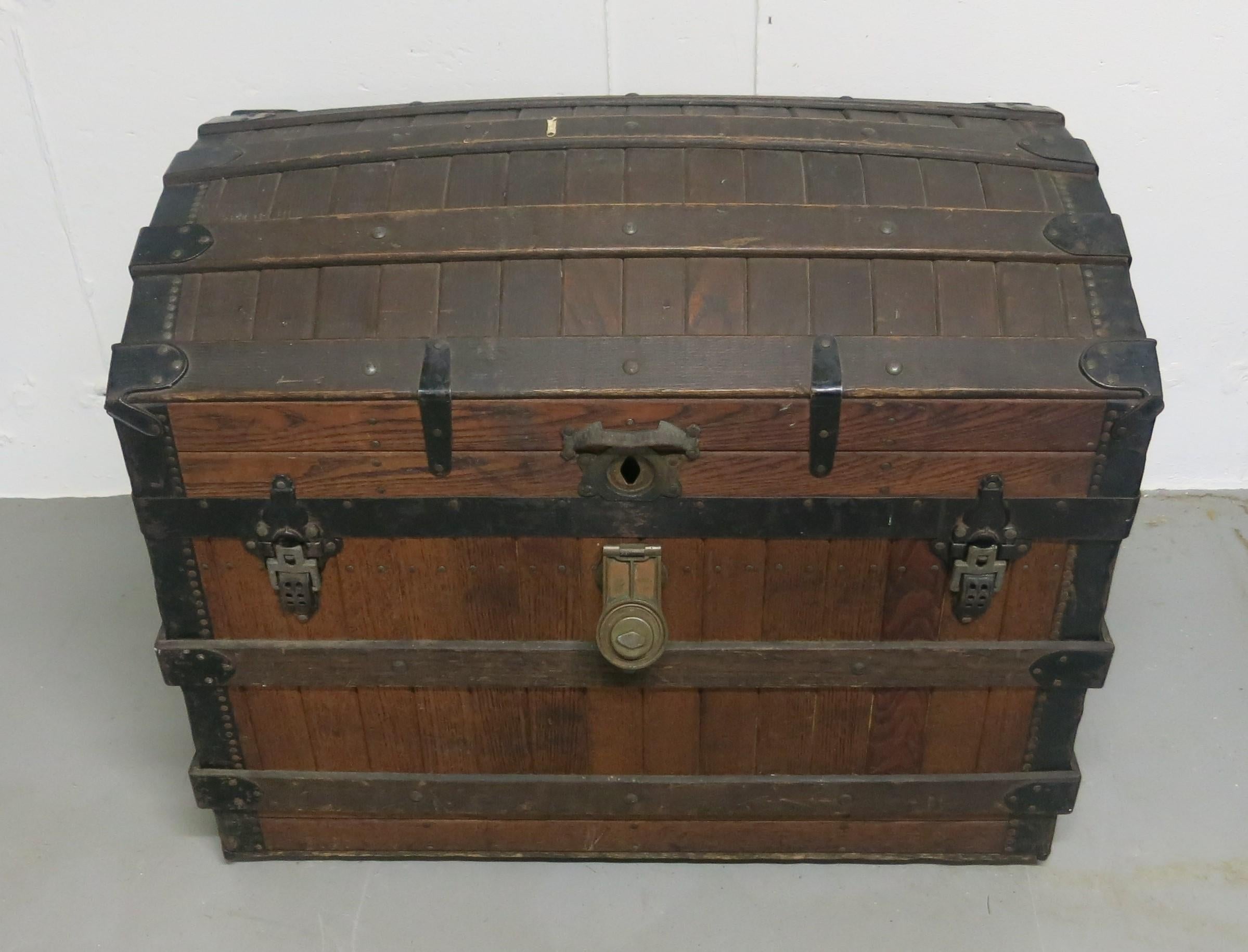 Excelsior slatted oak trunk patent date 1868. Clean exterior with original trays and handles. Interior all there but tops are unattached. Measures: It is 30.5