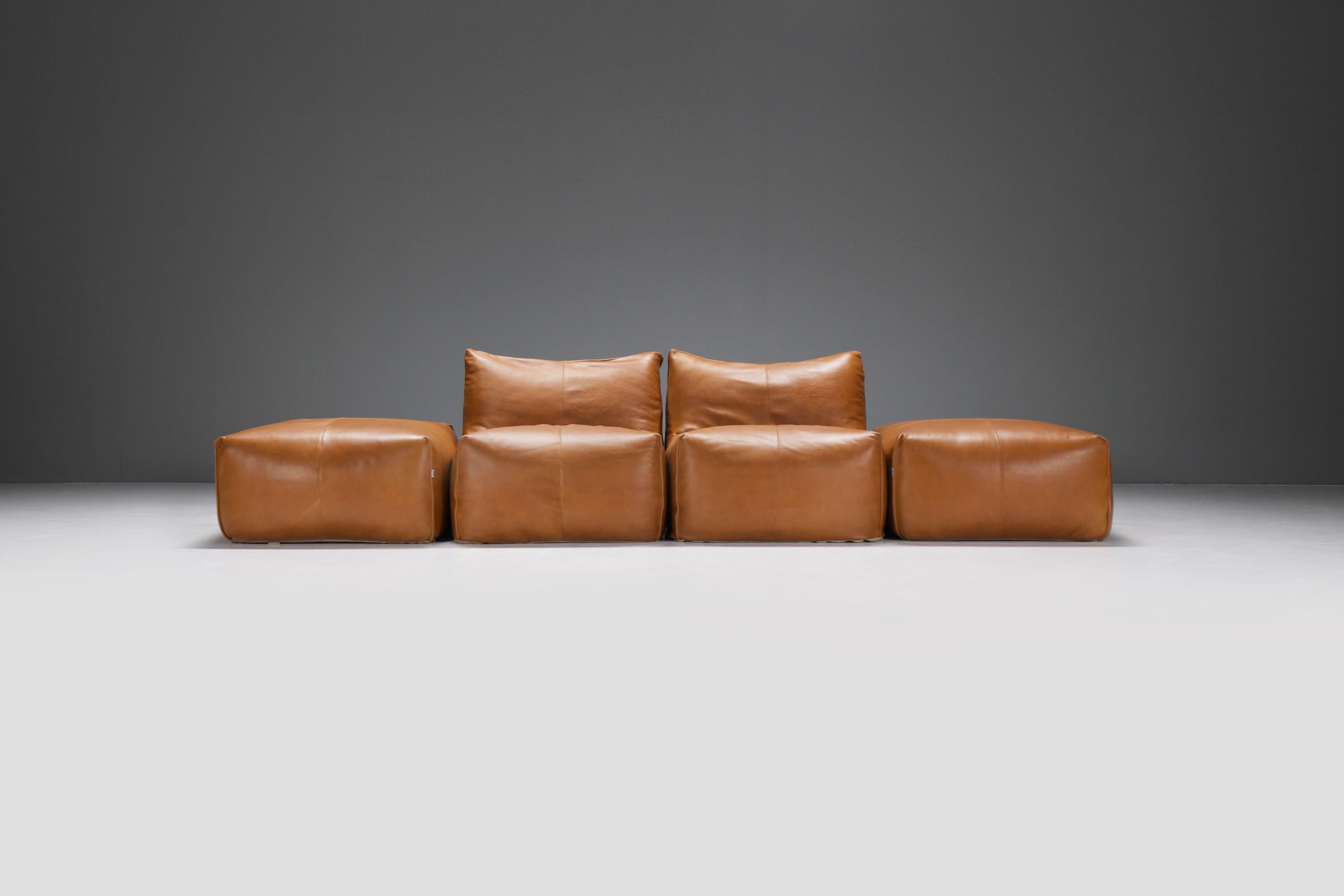Stunning vintage ‘Le Bambolé’ living room set in new cognac leather.Designed by Mario Bellini for B & B Italia.

Le Bambole series won the Compasso d'Oro award in 1979.  It is an iconic piece of Italian design. Included in the permanent collection