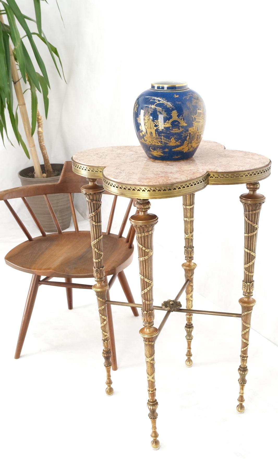 Exception clover shape pink marble top fluted brass legs tall pedestal stand.