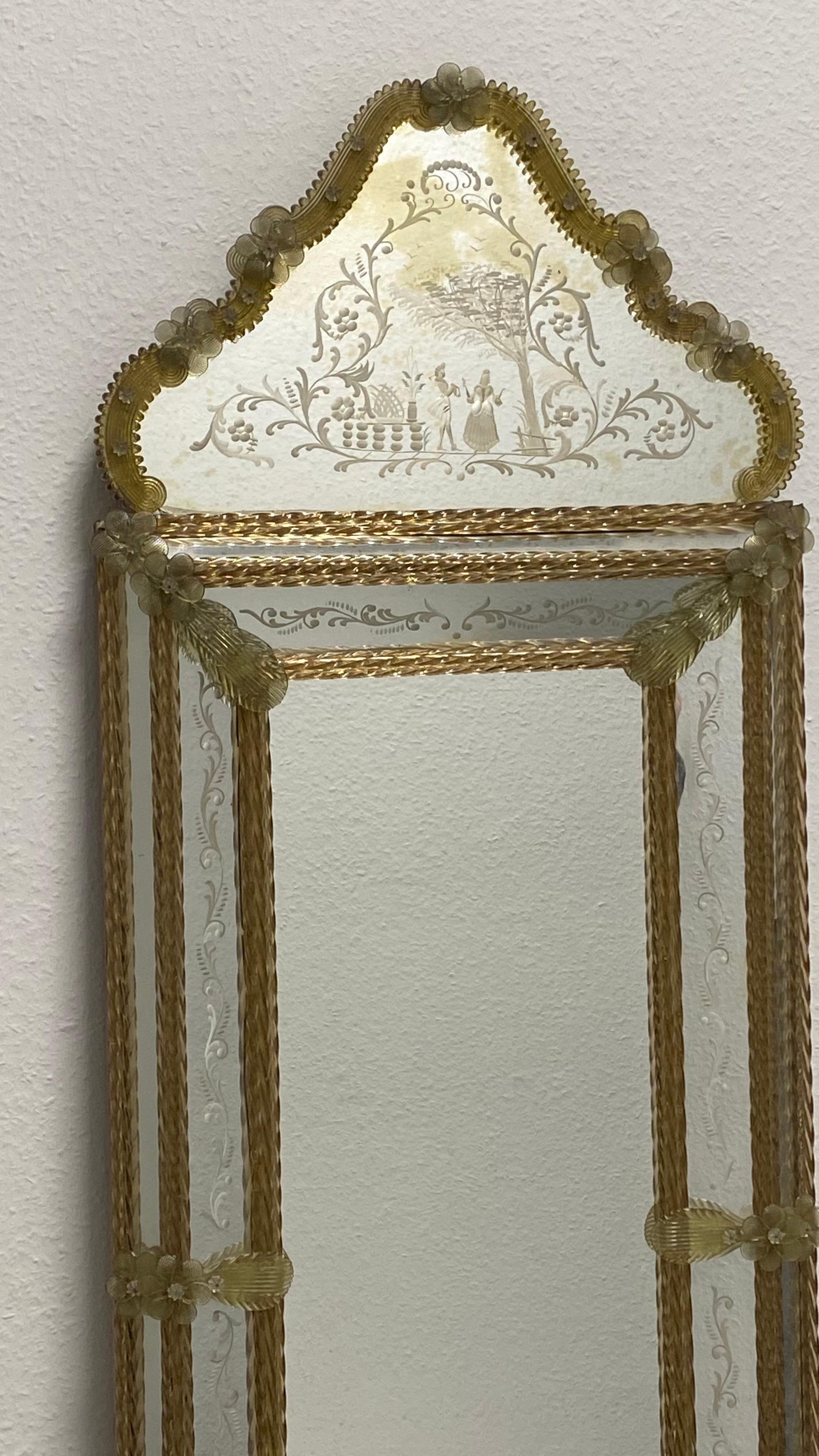 A stunning large Murano glass mirror surrounded with handmade gold flake glass flowers. Age approx. 1950s or older. A view small little distressed or blind spots in the mirror but this is old-age. With signs of wear as expected with age and use.