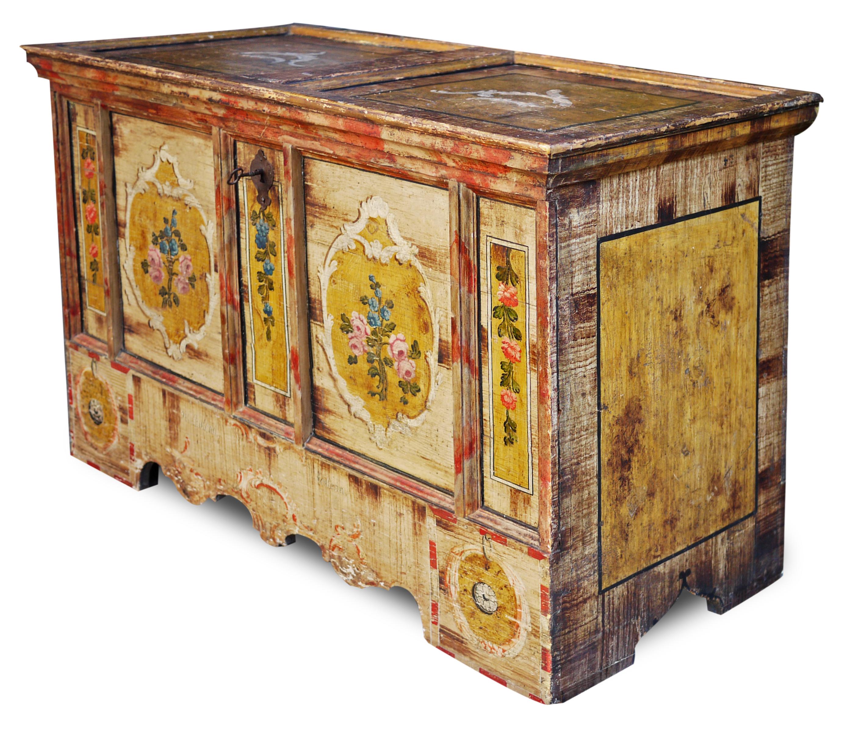 Antique floral painted tyrolean painted chest

Measures: H. 83cm – L. 131cm – P. 62cm

Antique painted chest, with light background.
The front has five backgrounds with floral decorations; in the lower cornice we find two mirrored garlands on