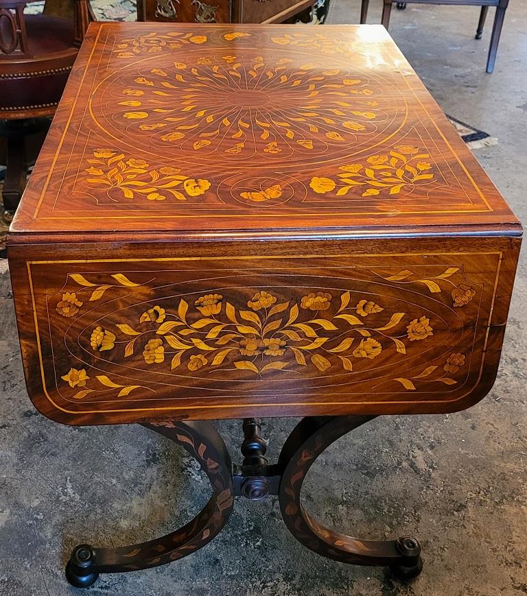 PRESENTING AN ABSOLUTELY Exceptional 18C Dutch Regency Marquetry Sofa Table.

Made in Holland/Netherlands circa 1790 – 1820.

Profusely inlaid with the most GORGEOUS marquetry inlay you will ever see !

Made of fabulous flamed mahogany with