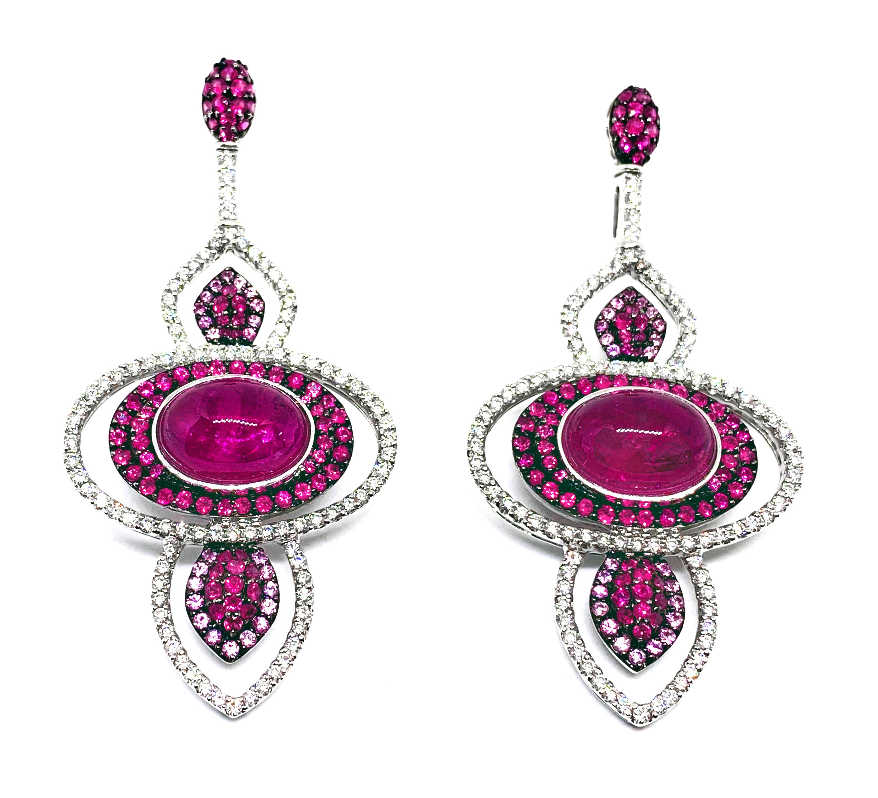 Certified 18 Kt White Gold earrings  with 3 ct diamonds, 5,69 ct ruby and pink sapphire and  17.35 ct central  cabochon tourmaline, exquisitely curated to captivate a sensuous palette of reds set with fine white diamonds.  The back is artfully
