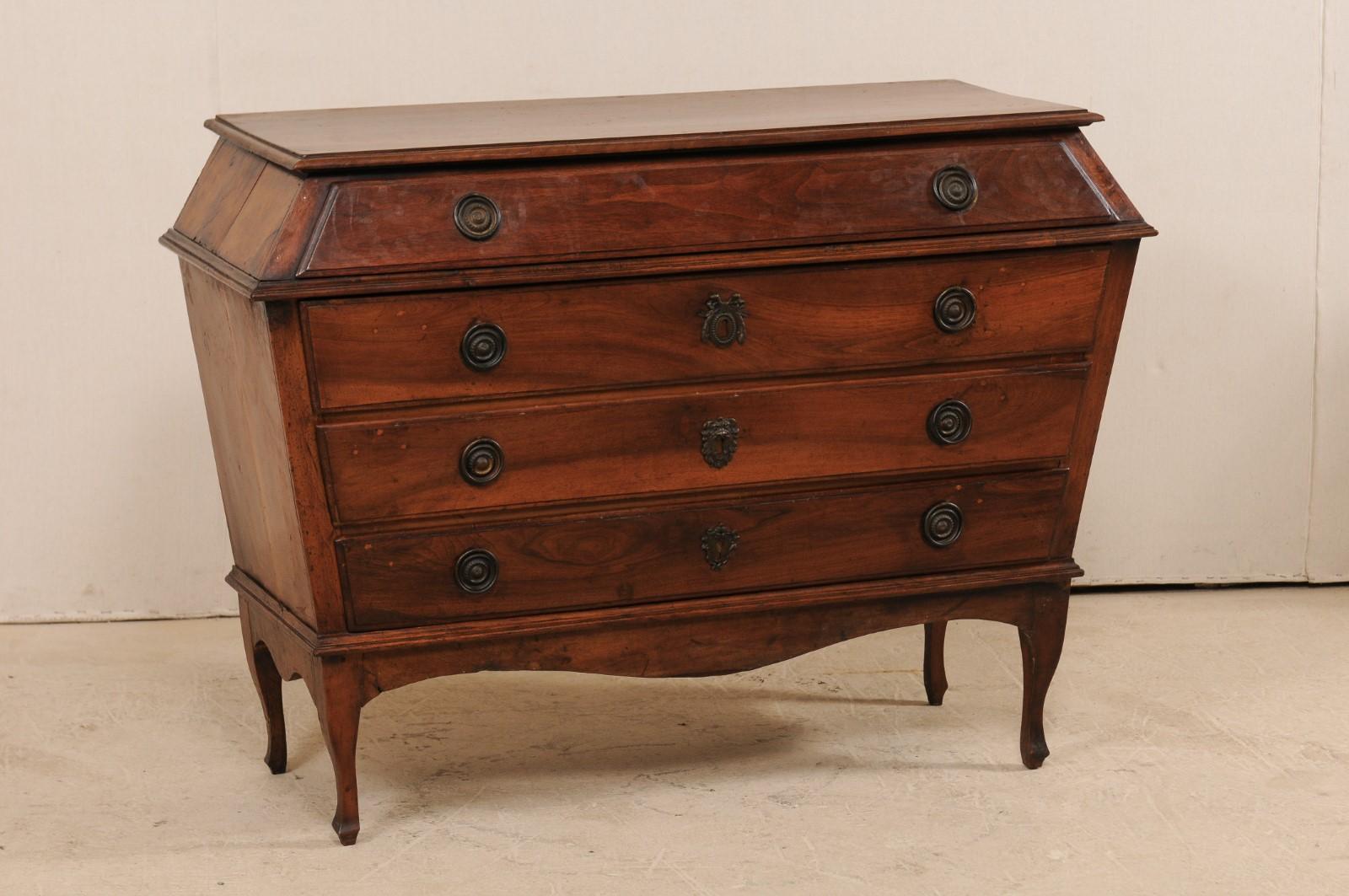 This uniquely designed Italian chest of drawers, from the late 18th-early 19th century, is perhaps one of the most beautiful pieces of furniture to pass through our doors! This antique Italian walnut commode features an unusual triangulated bombé