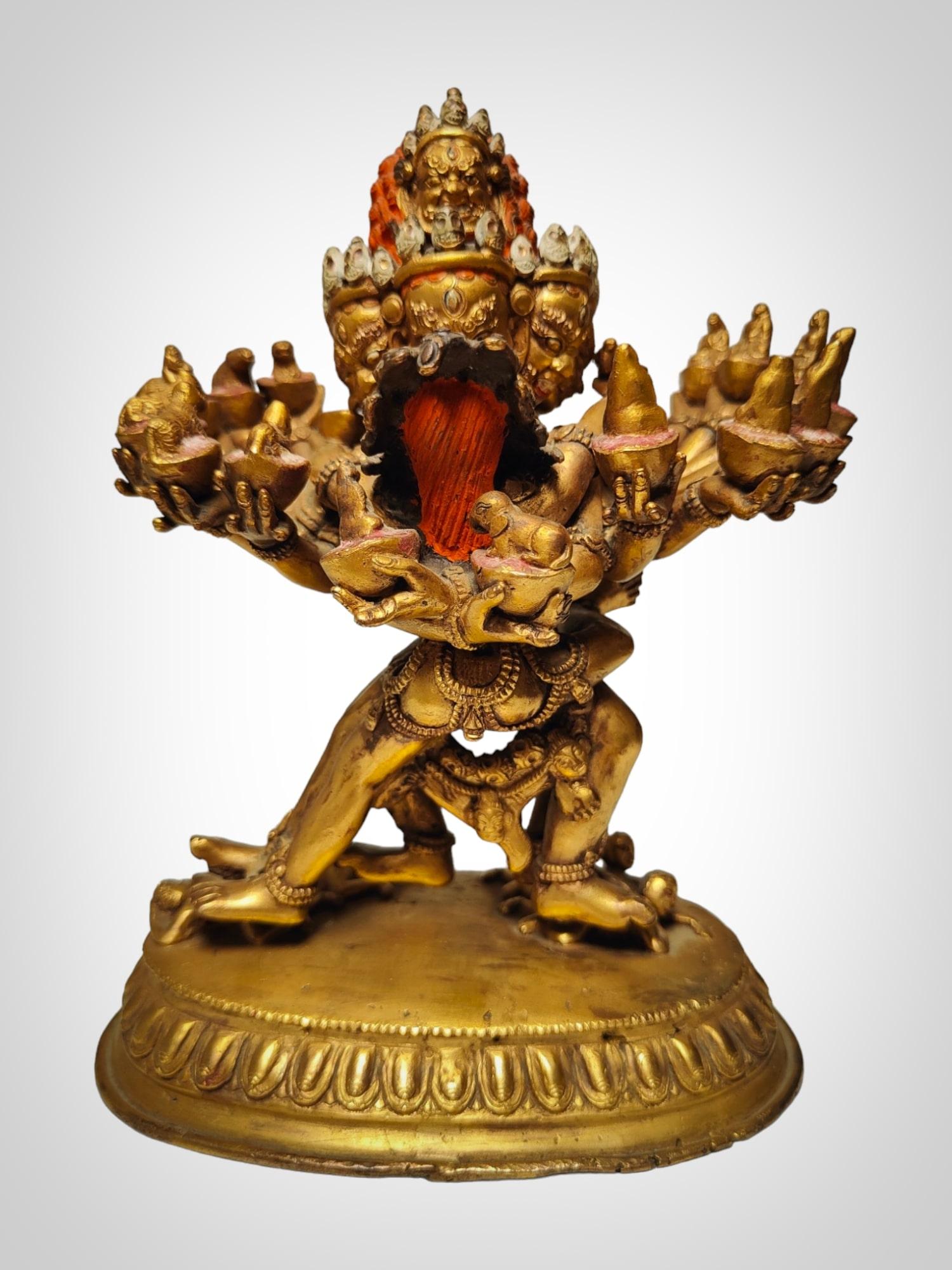 Immerse yourself in the divine splendor of this 18th-century Tibetan masterpiece—a gilt bronze figure depicting Cakrasamvara in the revered Yab Yum pose. Standing at a size of 21x17x10 cm, this exquisite sculpture is a testament to the spiritual and