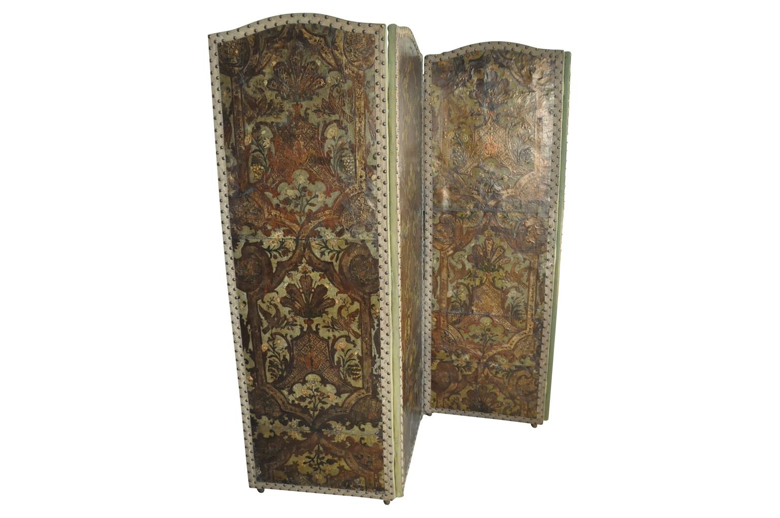 An exceptional 18th century Flemish 4-panel paravant - foldding screen. Beautifully constructed from hand tooled leather with magnificent polychrome. The colors are spectacular. Wonderful not only as a room divider, but wall-mounted as well. A