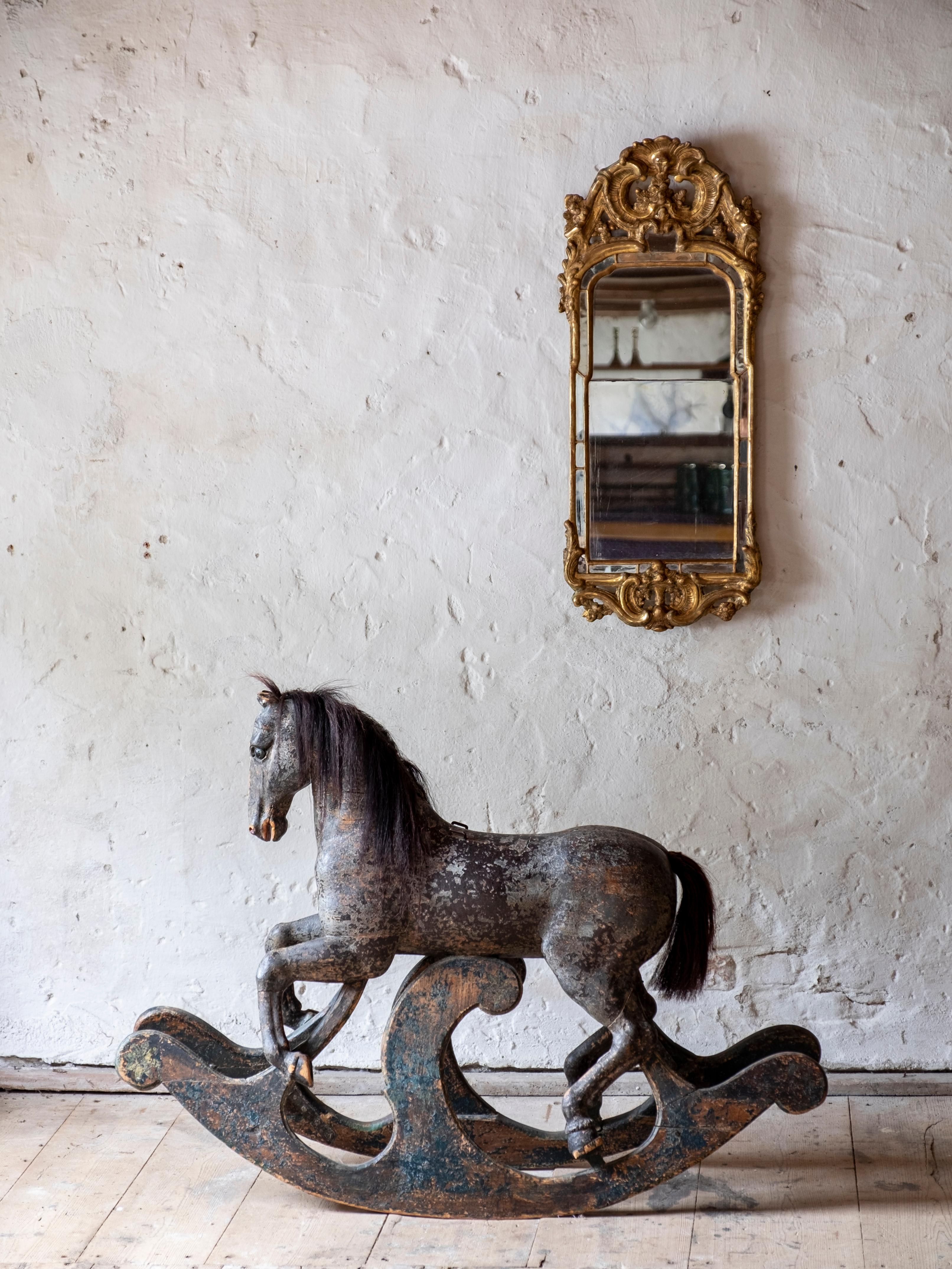 Exceptional 18th century Swedish wooden rocking horse in original color with great proportions and detail, circa 1750

The condition is very good. The horse is structurally good and sturdy. Original horsehair on mane and tail. The original paint