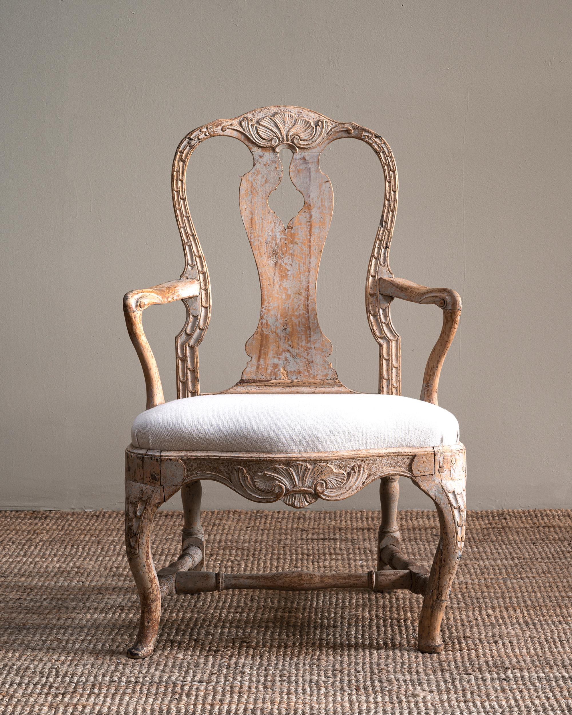 Exceptional Swedish 18th century Rococo armchair in it's original finish with great proportions and carvings. Ca 1760 Stockholm, Sweden.
