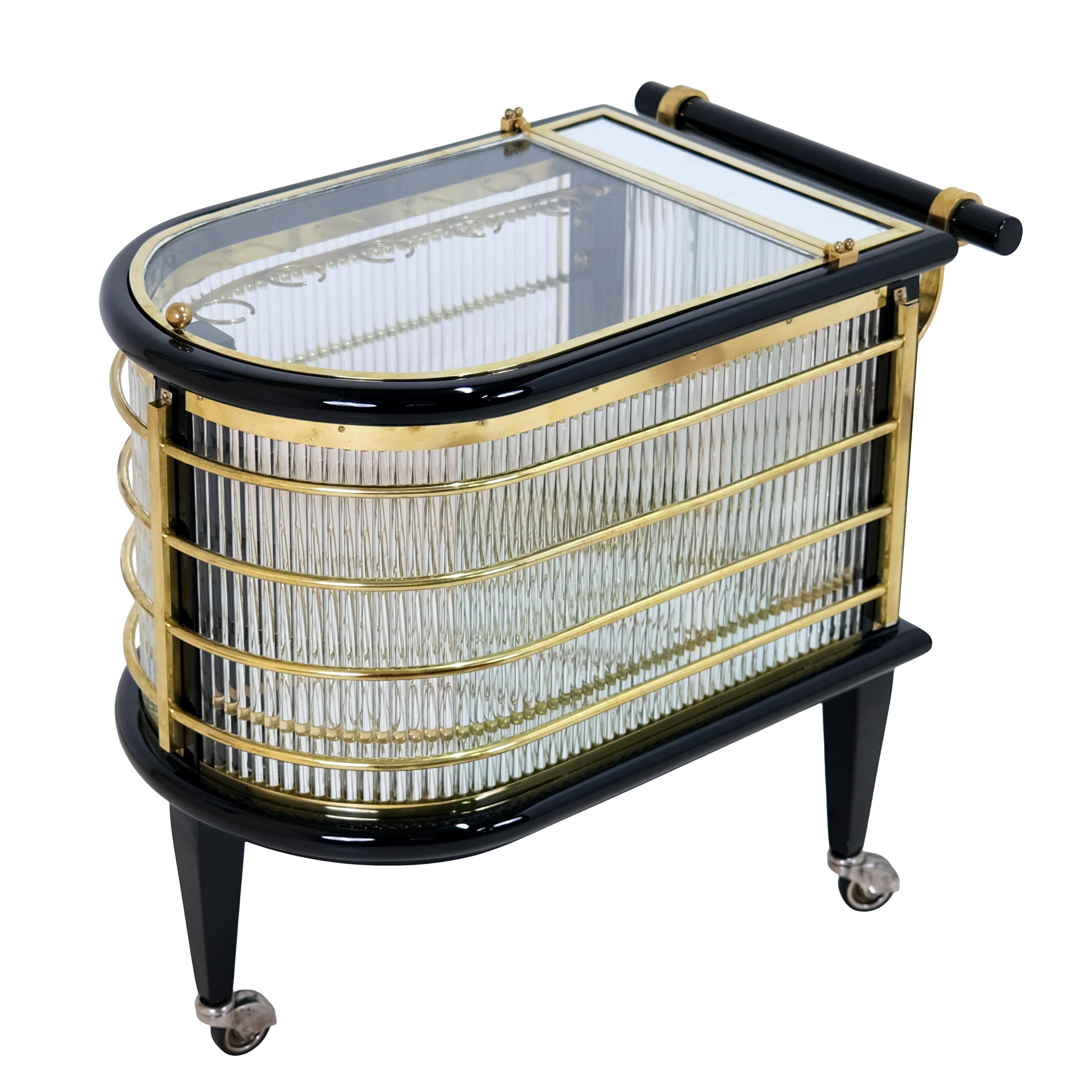 Luxury bar cart. 
Black Piono Lacquer
Brass, polished
New glass rods

Original Art Deco, France, 1930s

Dimensions:
Width: 70 cm
height: 65 cm
Depth: 43 cm.