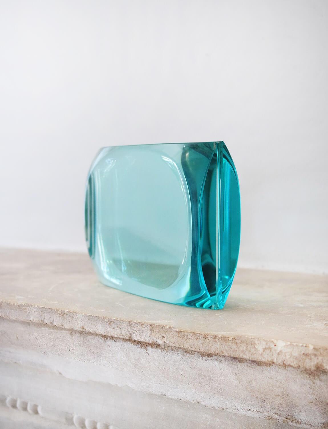 An extraordinary find. This perfectly designed heavy glass picture frame in hand-blown turquoise glass was made by Fontana Arte in the 1950s and was found here in Italy. The design allows a photo or picture to slide between the two thick panes of