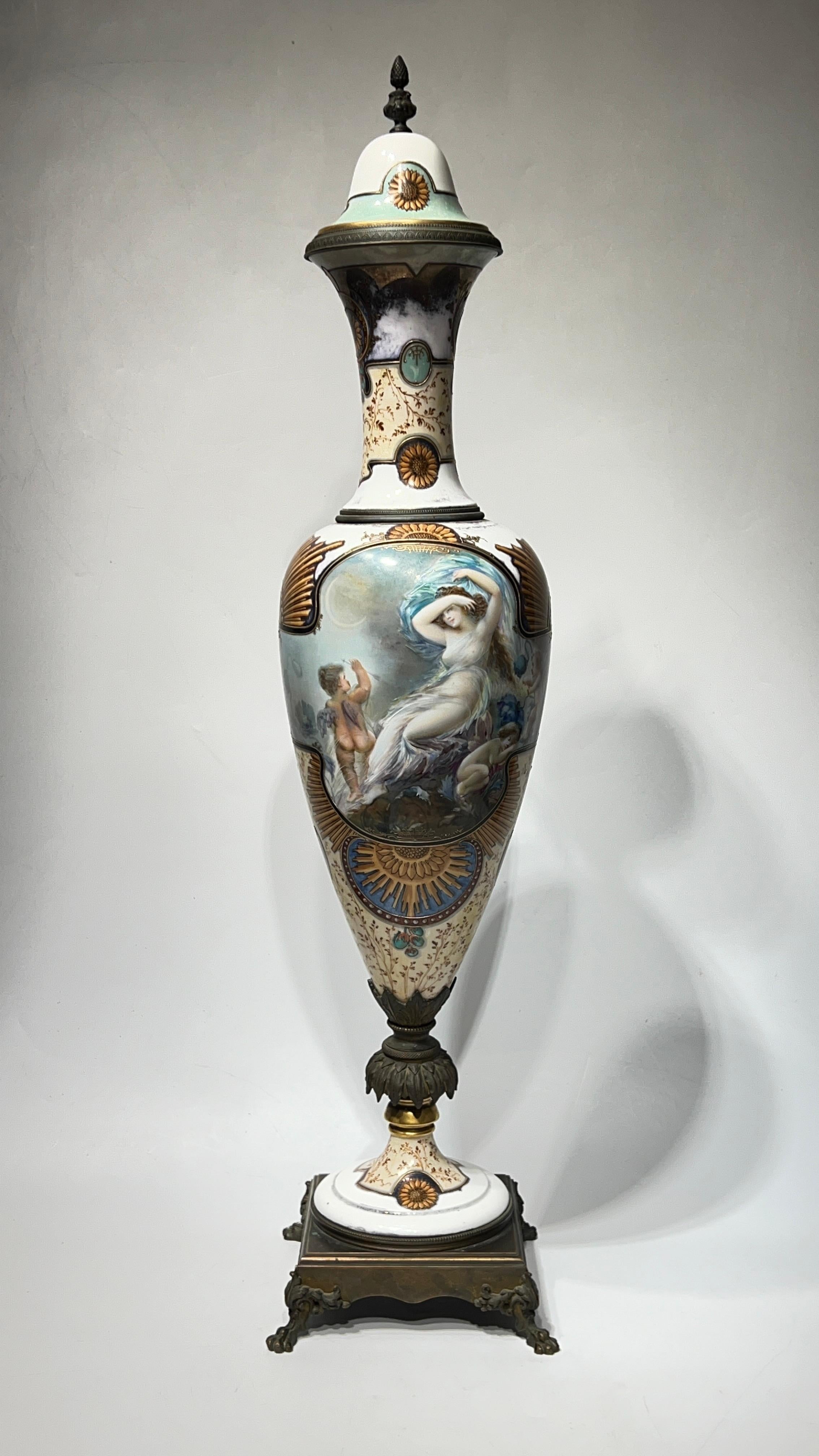 An exceptionally painted, gilt and enameled 19th century French porcelain vase in the neoclassical Sevres style raised on bronze base, distinguished by its vivid and finely painted cartouches depicting lovely maidens and cherubs.  Signed Lingard. 