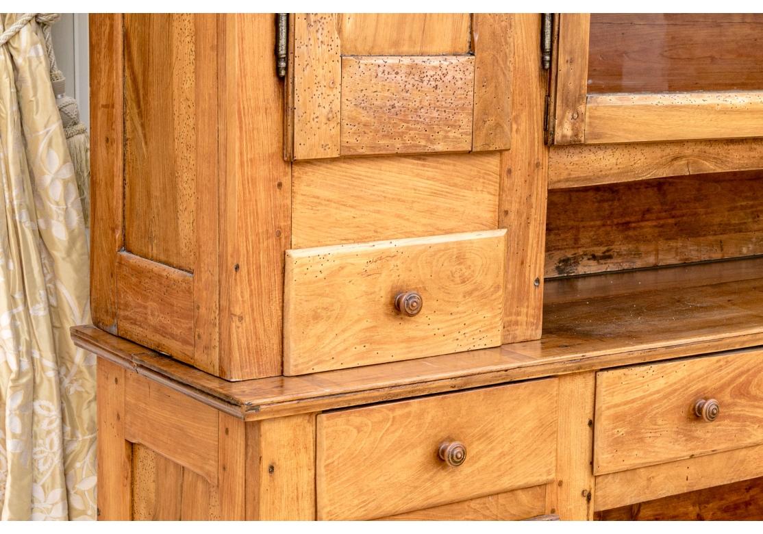 A large and very well made Antique Hutch with plenty of room for storage and display. The base unit has five  dove-tail constructed drawers with simple turned wood pulls, two doors opening to reveal storage space, a work surface and a low