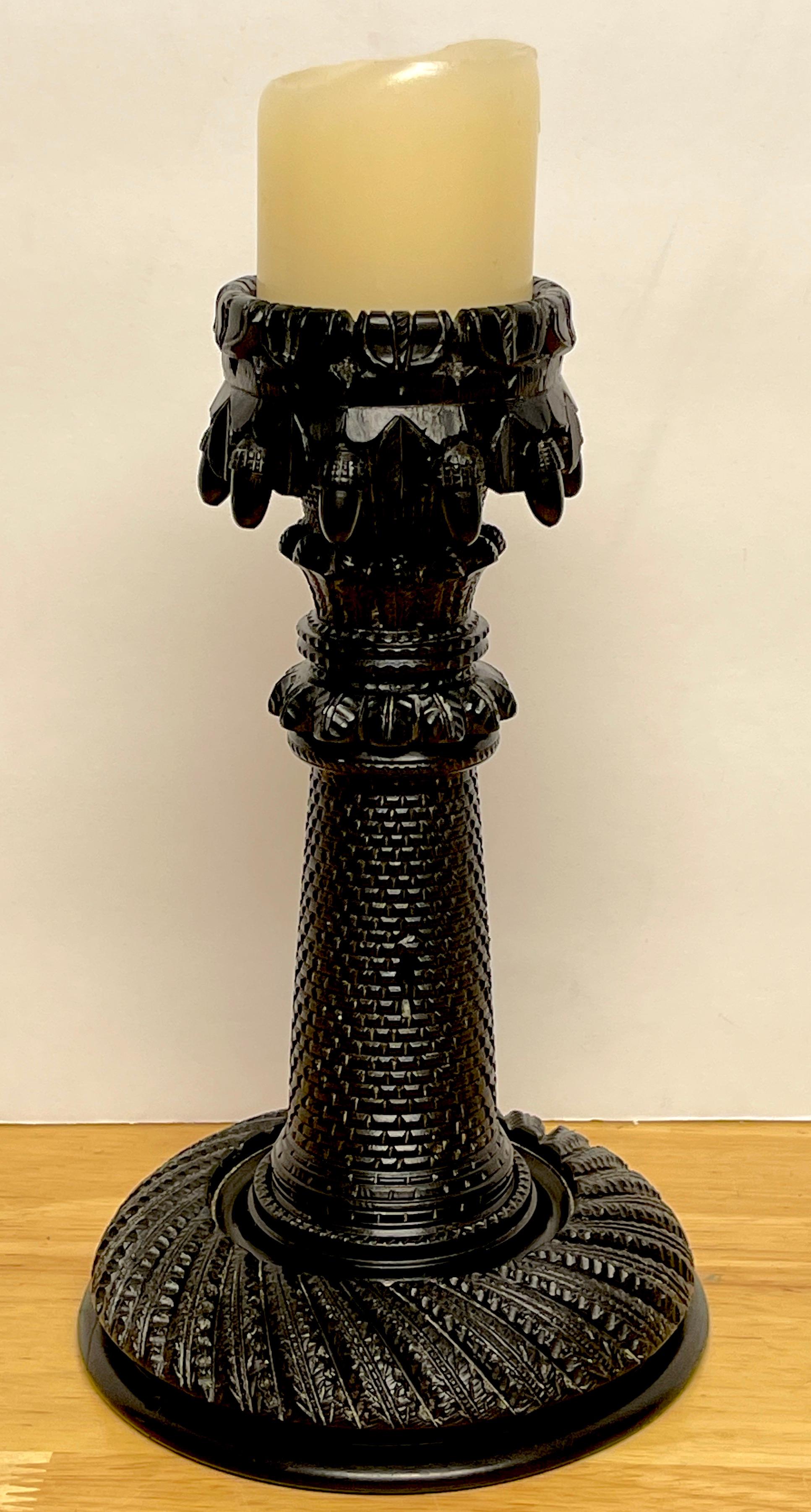 Exceptional 19th century Irish carved bog wood castle motif candlestick, Intricately carved, the bobeche with a continuous ring of carved acorns, the column of a brick and motor bricked windowed castle tower, resting on a circular reeded base. The