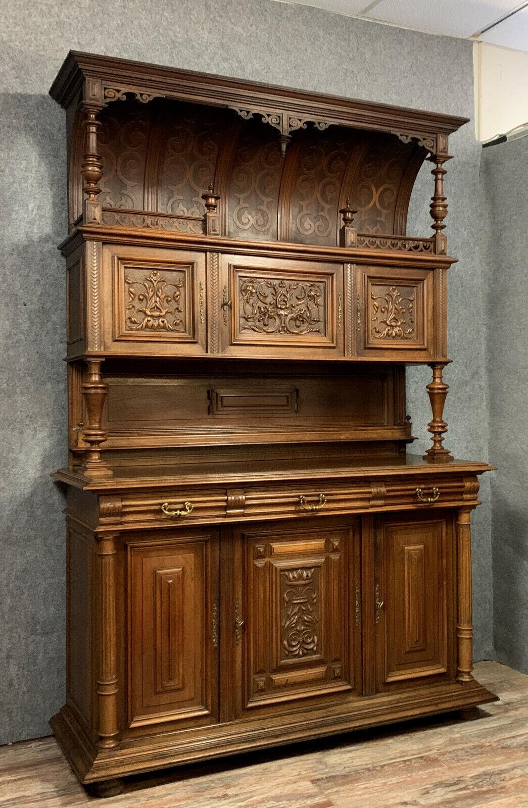 Elevate your living space with the timeless elegance of this exceptional Renaissance-style two-body buffet from the 19th century. Crafted from solid walnut, this magnificent piece exudes grandeur and sophistication, making it a standout addition to