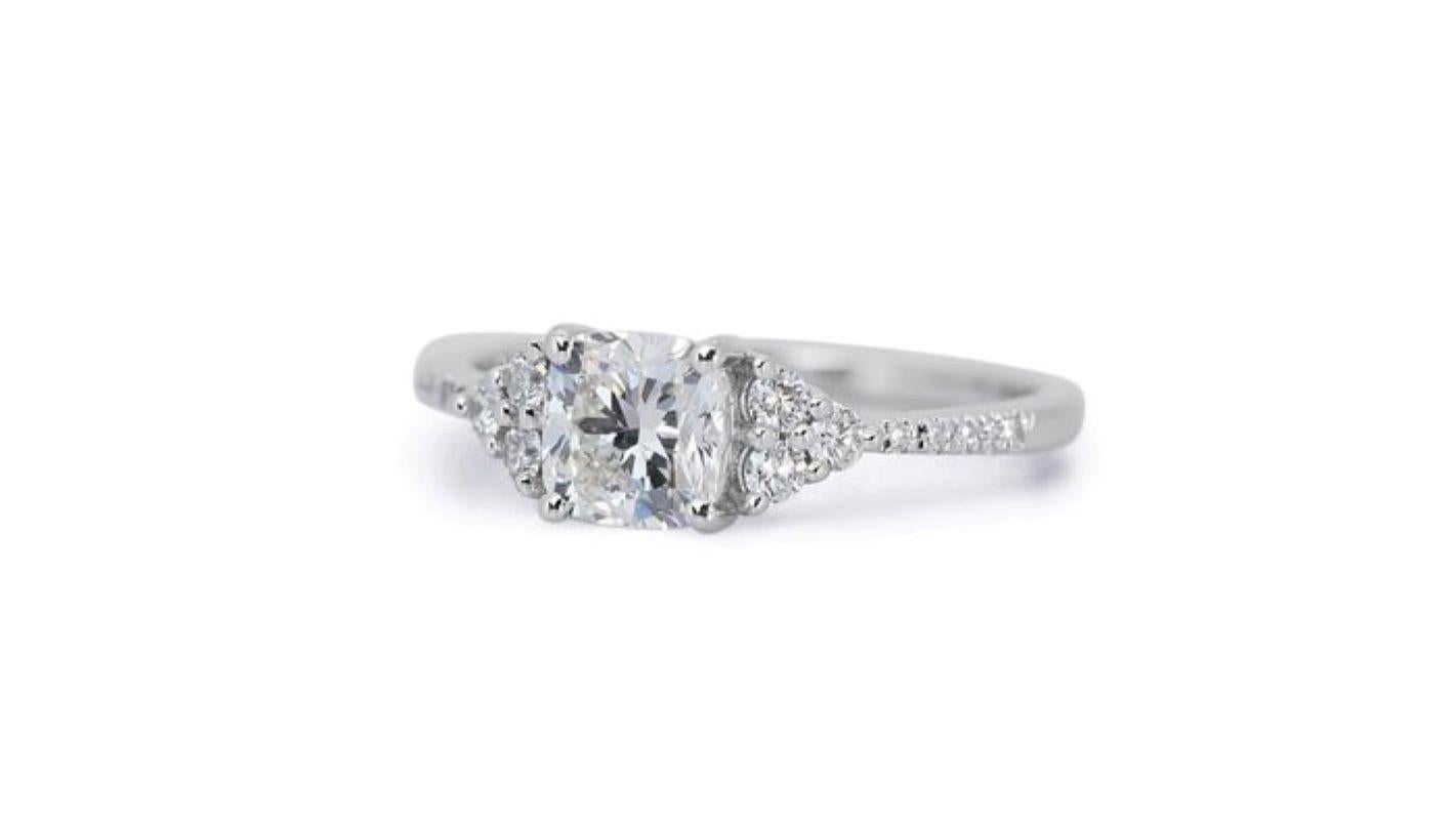 Unveiling a masterpiece of brilliance and elegance, this exquisite ring showcases a captivating 2 carat cushion modified brilliant diamond, boasting exceptional fire and scintillation. This internally flawless (IF) center stone, the pinnacle of