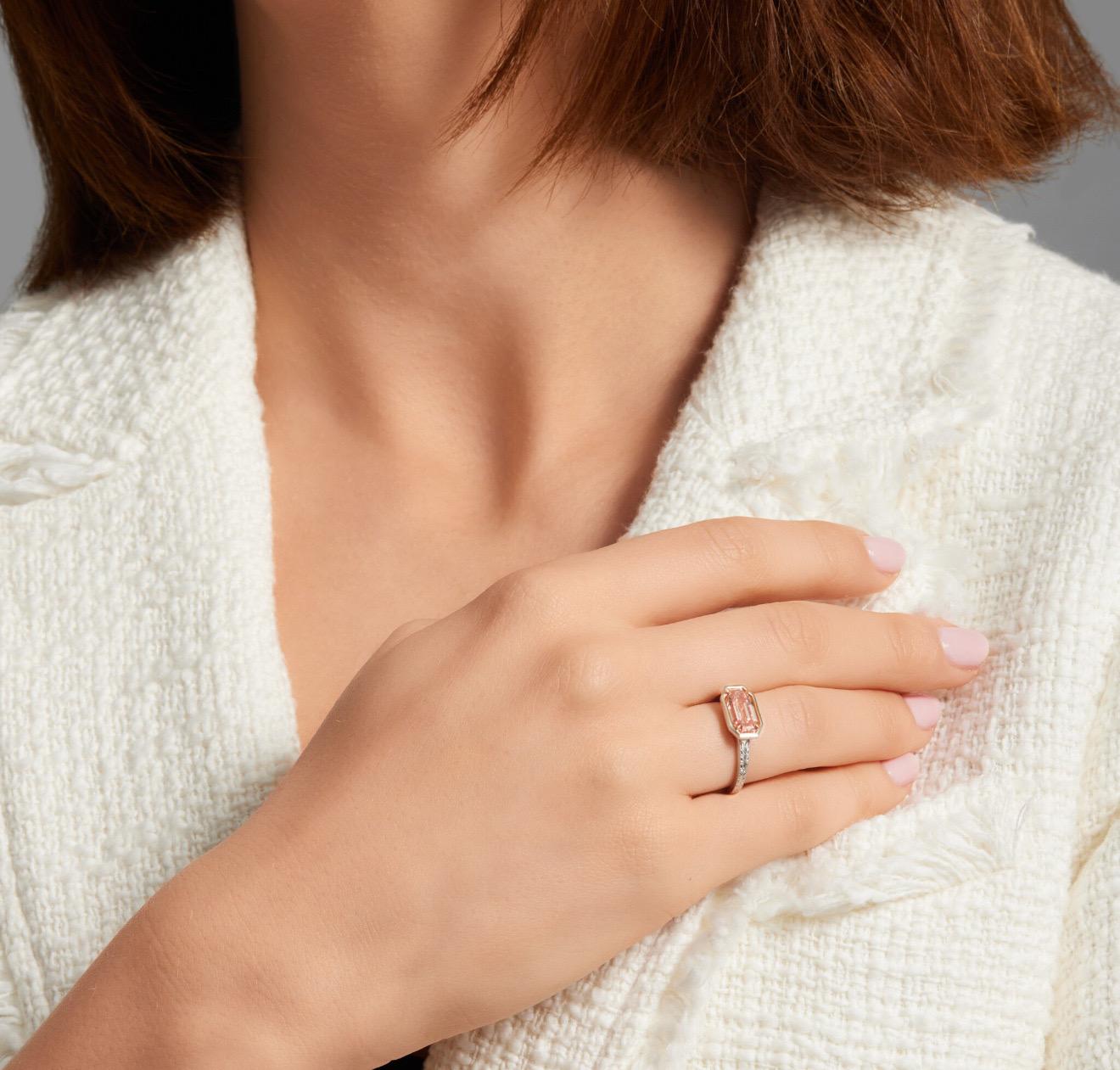 Presenting a truly singular treasure in the world of natural fancy color diamonds: a 2.02 carat GIA-certified Fancy Orangy Pink diamond, cut in an elongated cut-cornered rectangular step cut with an extraordinary 1.998 length-to-width ratio.
This