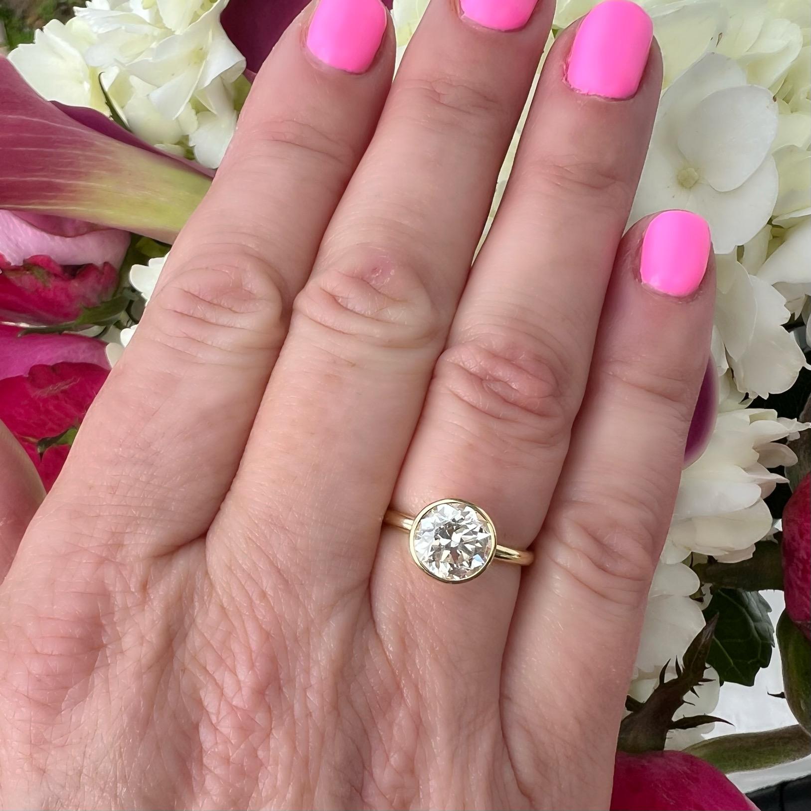 Truly a one of a kind! This exquisite 18 karat yellow gold beauty features a gorgeous Old European Cut Diamond weighing 2.04 carats, expertly bezel set in this open basket design allowing for the entire stone to be visible from table to culet. The