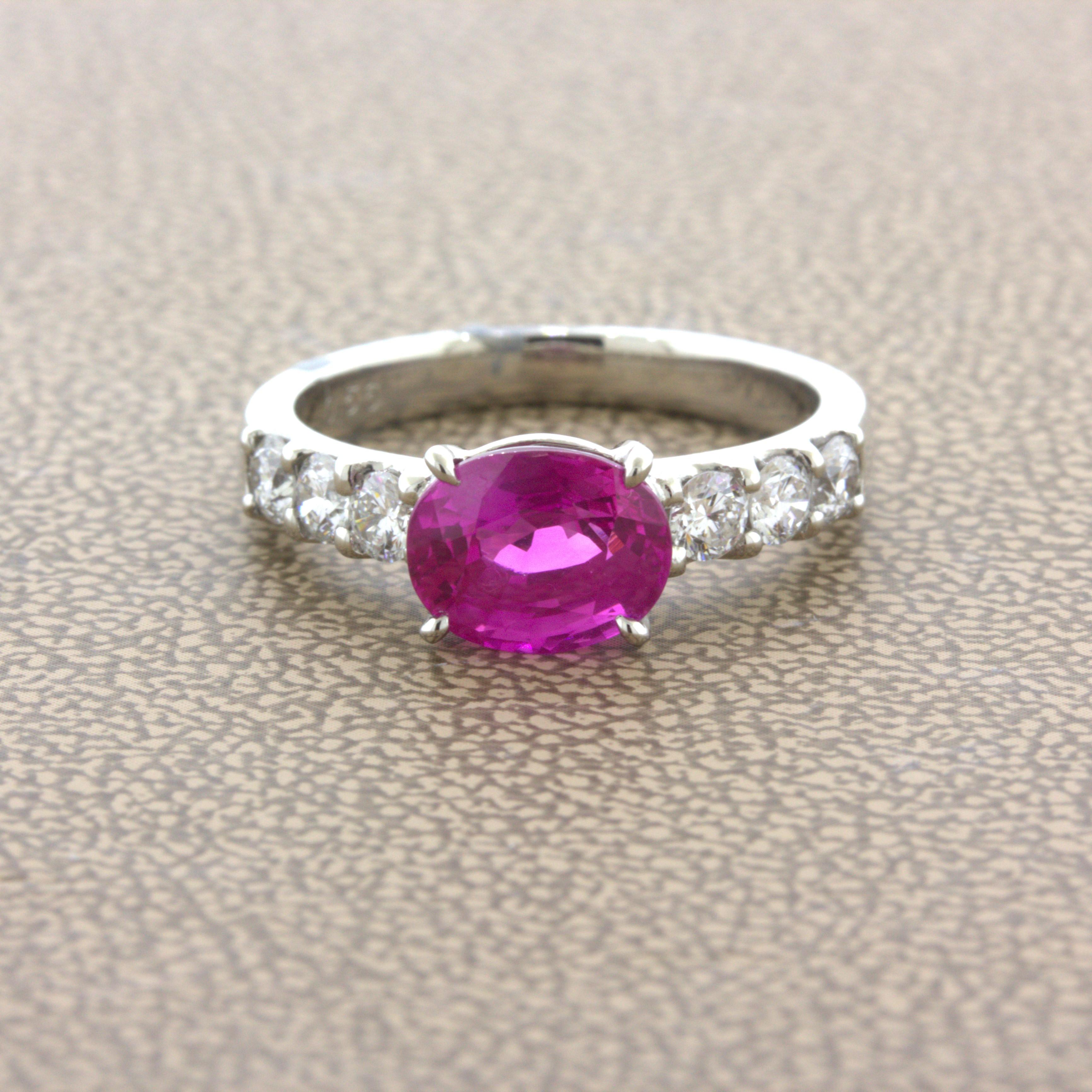 A super fine top-gem pink sapphire with outstanding vivid color. It weighs 2.36 carats and has an intense hot-pink color that is exceptionally strong and fine. It has a lovely oval-shape and is certified by the GIA as natural. Complementing the gem