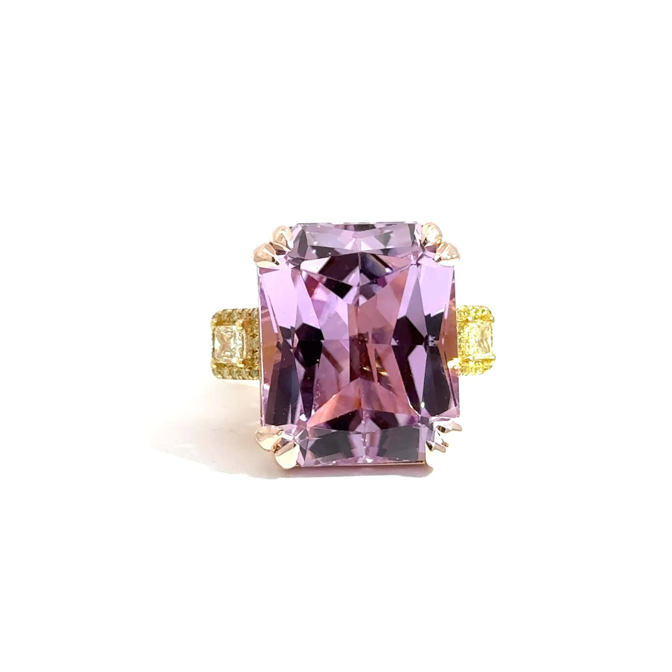 An eye-catching fusion of color and craftsmanship, this extraordinary cocktail ring showcases a striking 31.46-carat emerald-cut Kunzite—celebrated for its vibrant pink-lavender hue and exceptional clarity. The custom setting, handcrafted in 14k