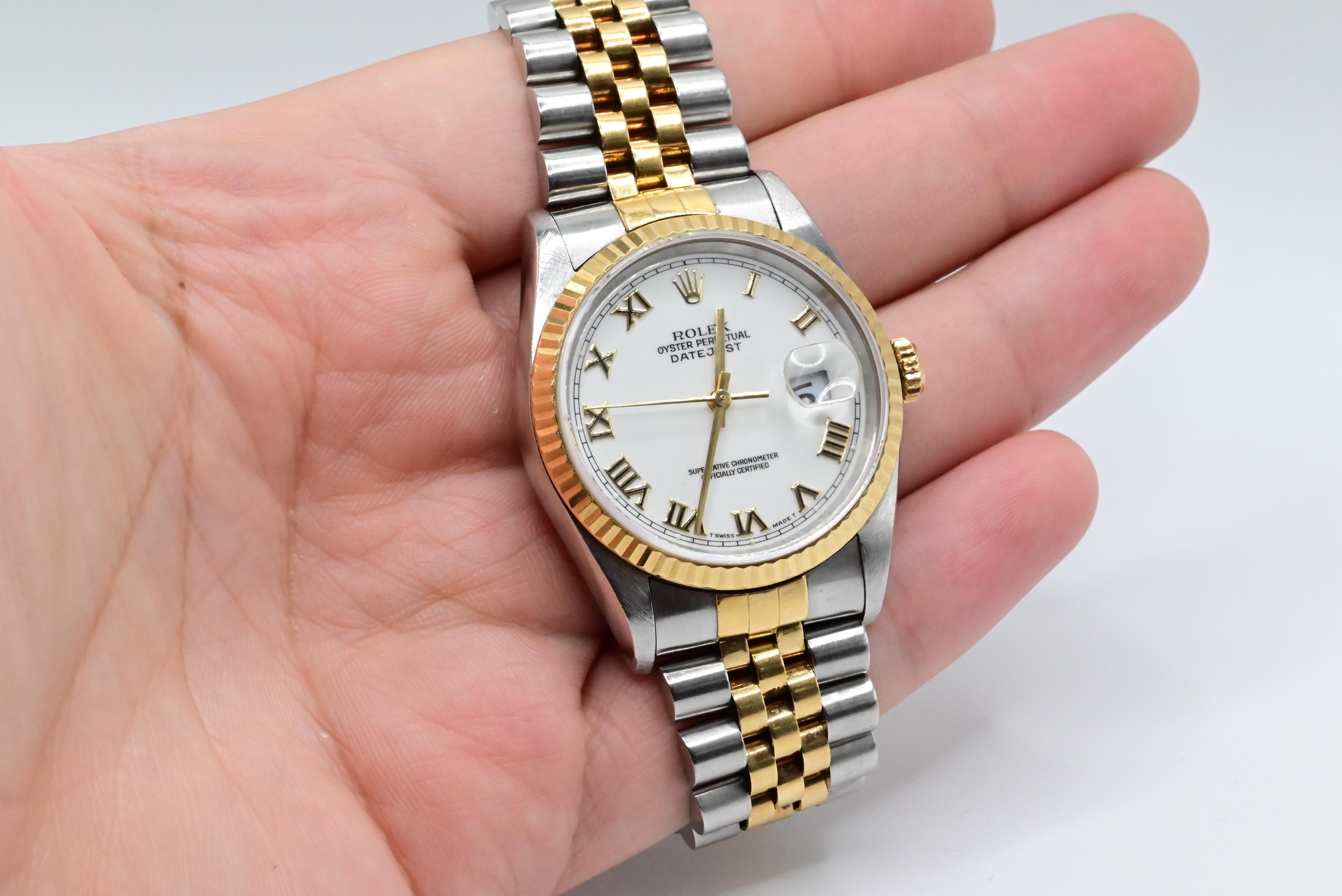 Rolex Wristwatch with White Dial Roman Numeral 
Model Datejust Two Tone 16013
36MM Size Case
In Perfect Working Order
Has normal use ware but no damage 
Can be worn by Men or Women
No Box or Papers 
1980-1990s model


