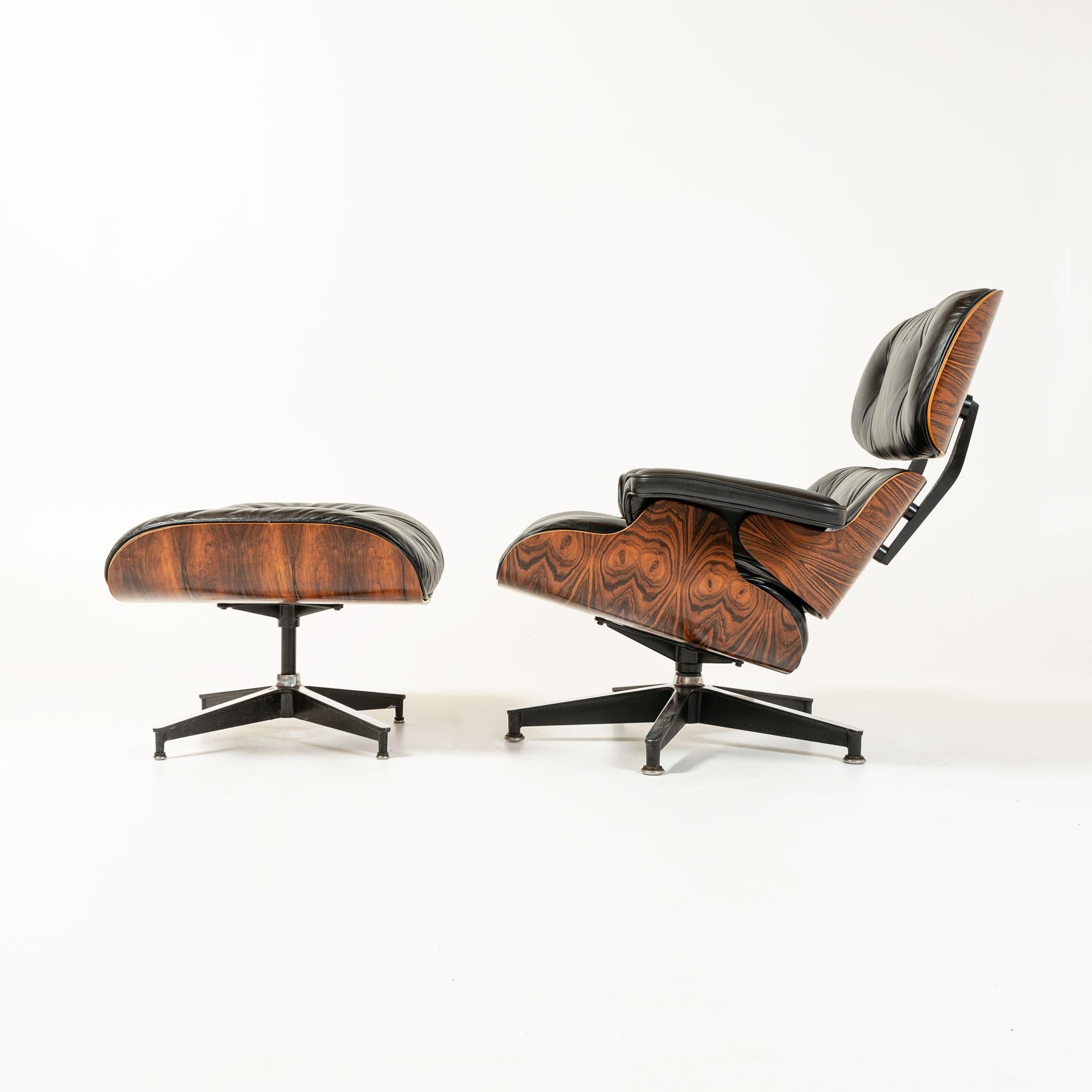 3rd Gen Eames lounge chair with ottoman with exceptional grain in original finish rosewood shell and restored black leather cushions.

Production dated 26th of June 1984, this is one of the most visually striking grain pattern Eames Lounge Chair we