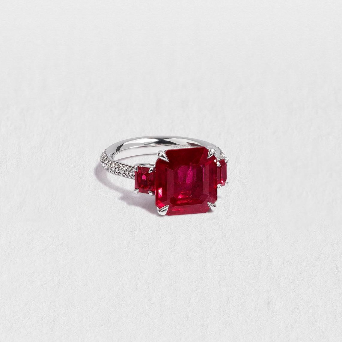 This peerless three-stone ring is truly unforgettable thanks to its commanding centre ruby, made rare by its large size. Mined and cut in Thailand, the breathtaking stone is shouldered by two smaller rubies, also from Thailand. All three stones are
