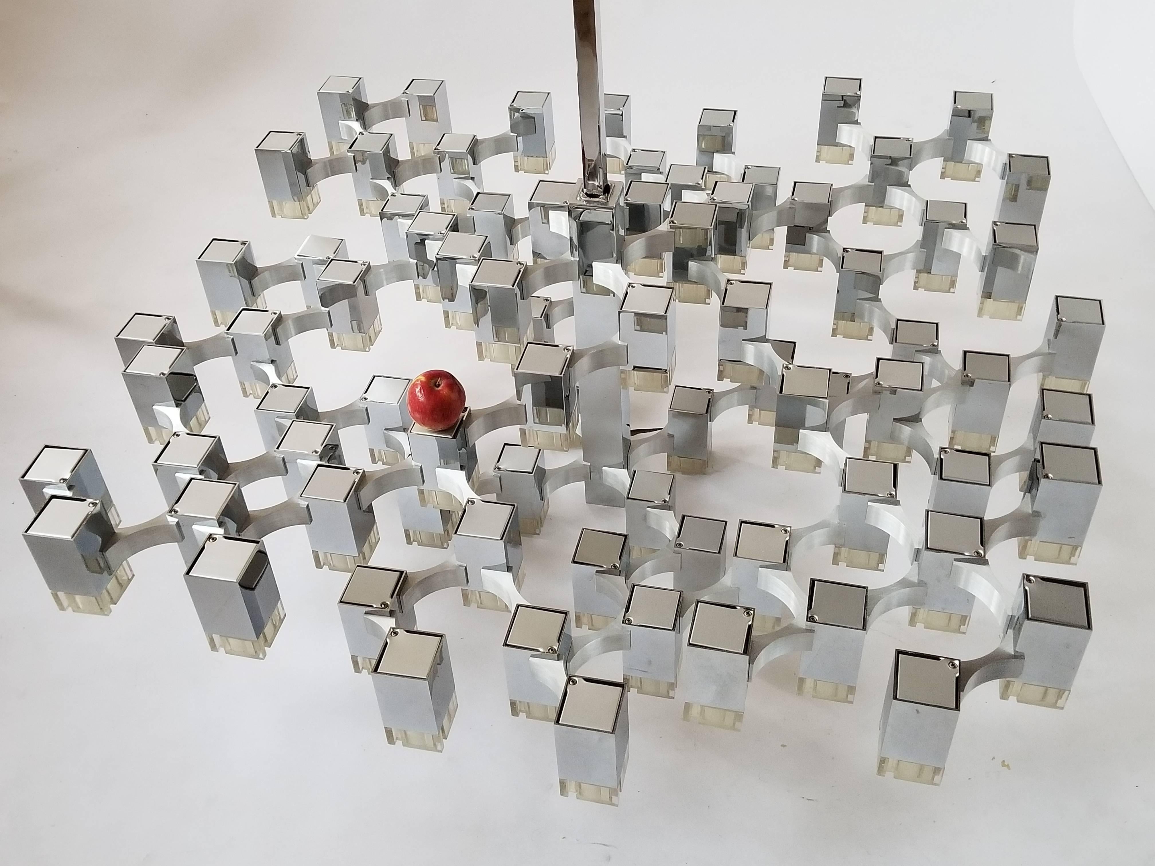 Iconic, rare  lighting art piece from Gaetano Sciolari with 81 cubes . 

Structure is made of  chromed brass cubes connected togheter with  aluminim bridge .

Prime quality material, solid construction, fine assembly and craftmanship. 

A pull down