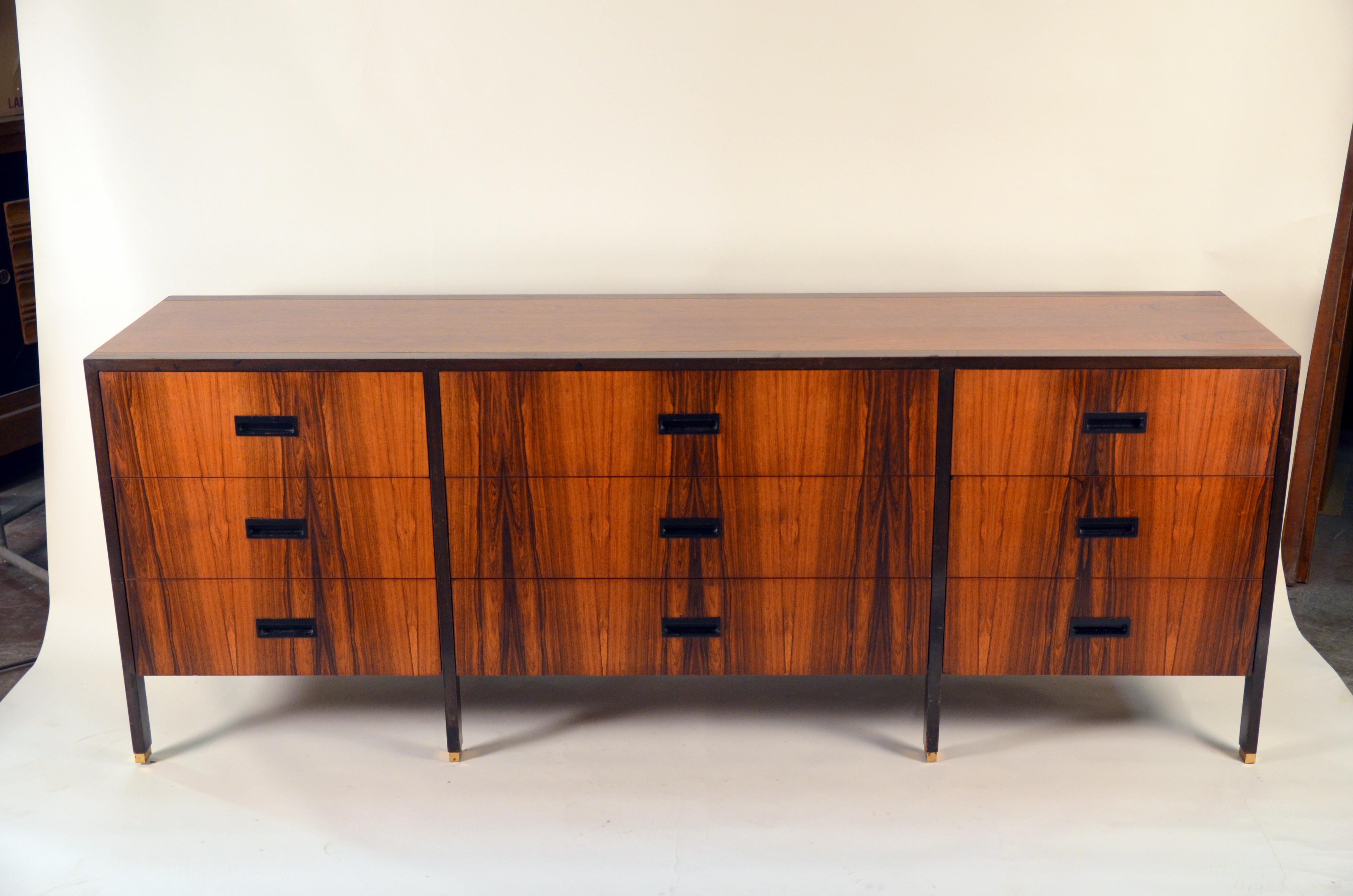Exceptional Harvey Probber 9-drawer dresser in rosewood and ebonized mahogany with brass feet.

Harvey Probber (1922-2003), a design autodidact in a profession largely dominated by formal architectural training, began his creative career at age 16