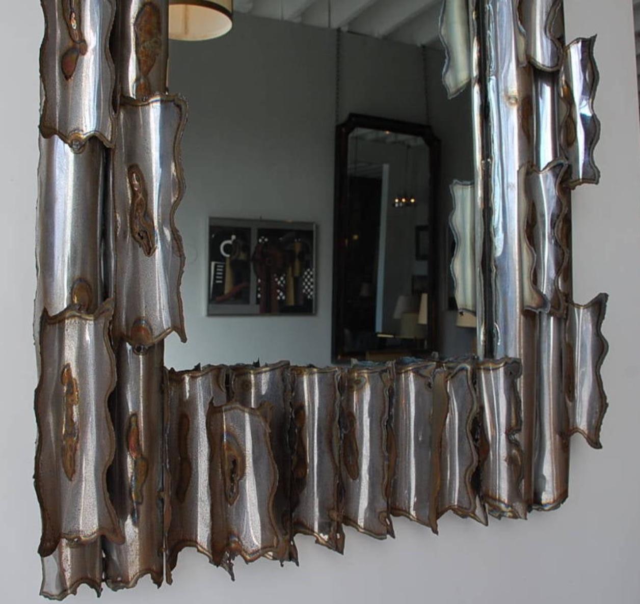 Exceptional American brutalist mirror. Signed and dated 1978.