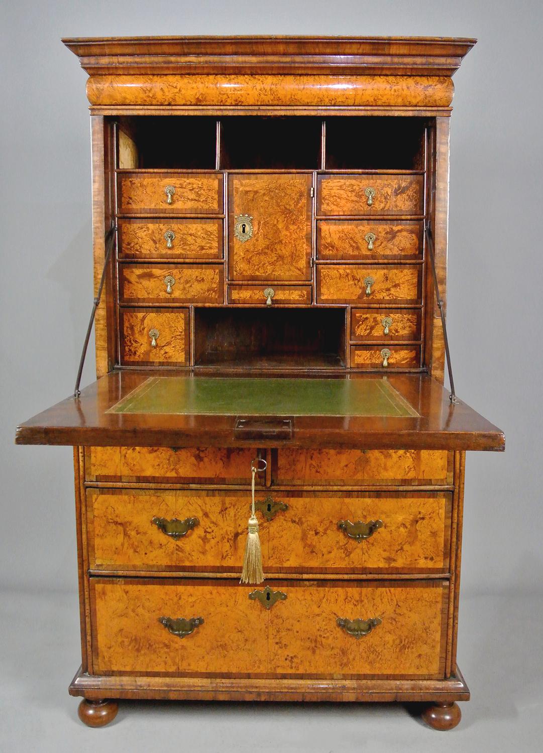 A very small and finely made Queen Anne English Escritoire (an English Scriptor) 1690-1710
Petite, demonstrating masterful skill and attention to detail, each element made with extraordinary craftsmanship.   
The outer fall with a central mulberry