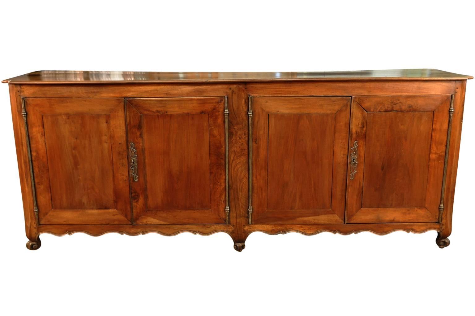 An exceptional and grand scale 18th century credenza from Northern Italy. Masterly constructed from stunning walnut with very elegant lines.