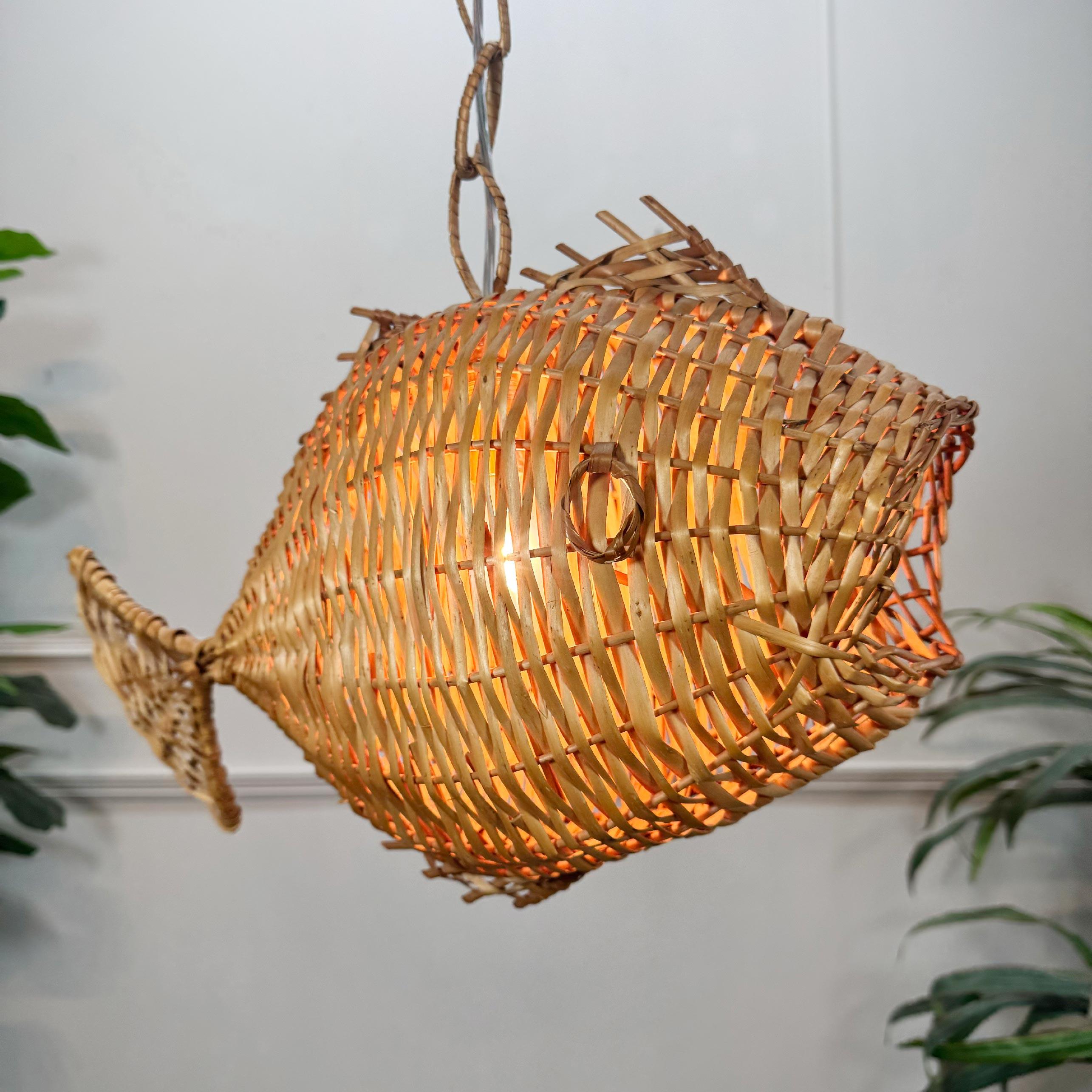 Superb 1950’s wicker fish ceiling light, French. Due to their nature these original ceiling lights are incredibly rare to find from this period and especially in such good condition.



The single e14 (small screw in) Edison lamp holder sits inside