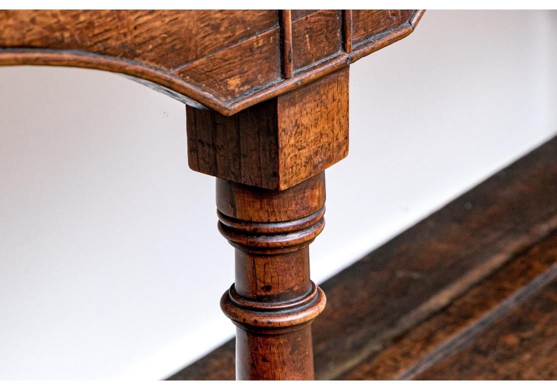 A particularly notable long antique Hunt Board, likely late 18th/Early   19th Century. With stately Georgian and William and Mary influence, well crafted with a warm-toned medium brown wood having desirable graining. The long rectangular top