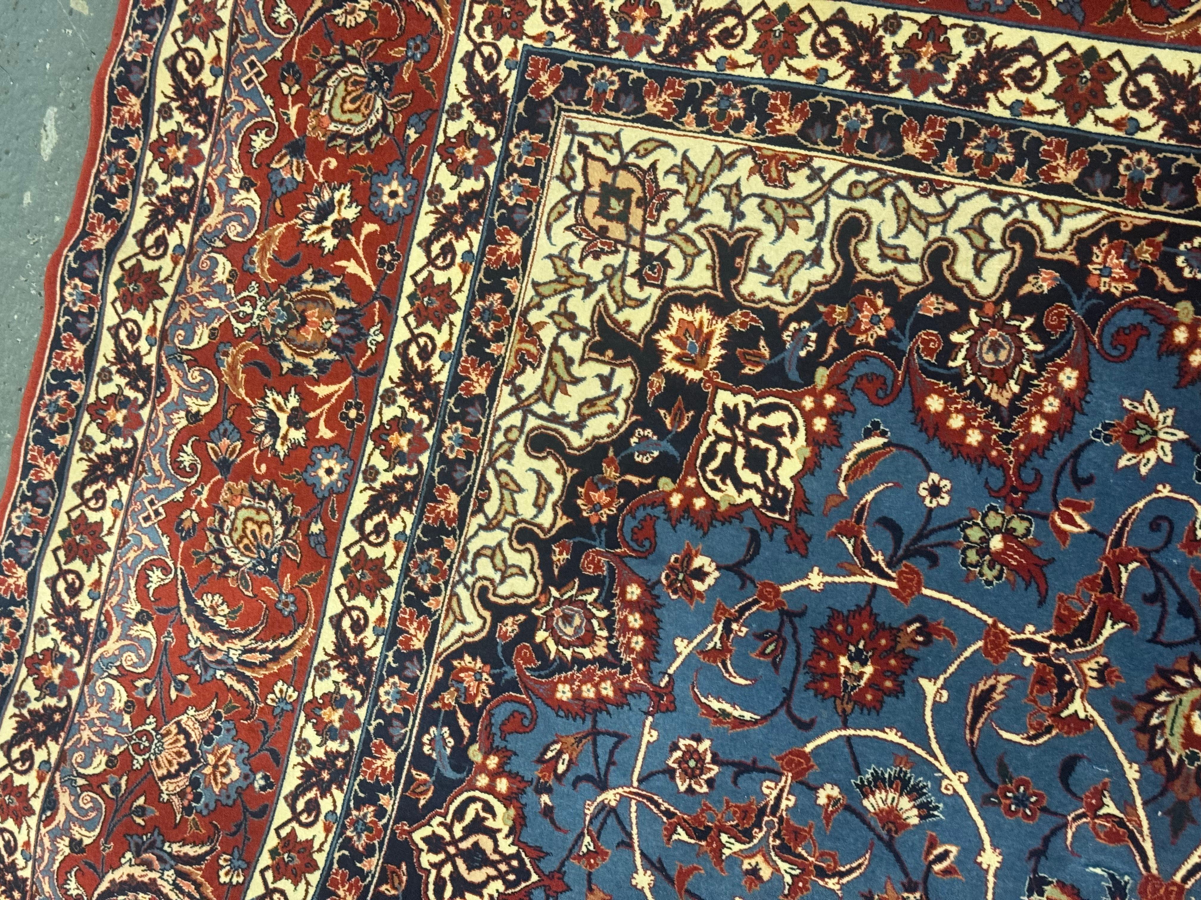 This rug is a fine example of a wonderful silk and kurk (baby lamb wool) traditional wool rug by a famous Isfahan 