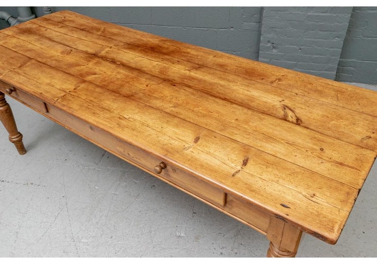 A particularly desirable antique farm table with a great size and a fantastic timeworn softness. Long and solid feeling, the Plank Top has great wear that only comes with many years of use. The top removes for travel and the Apron houses two large
