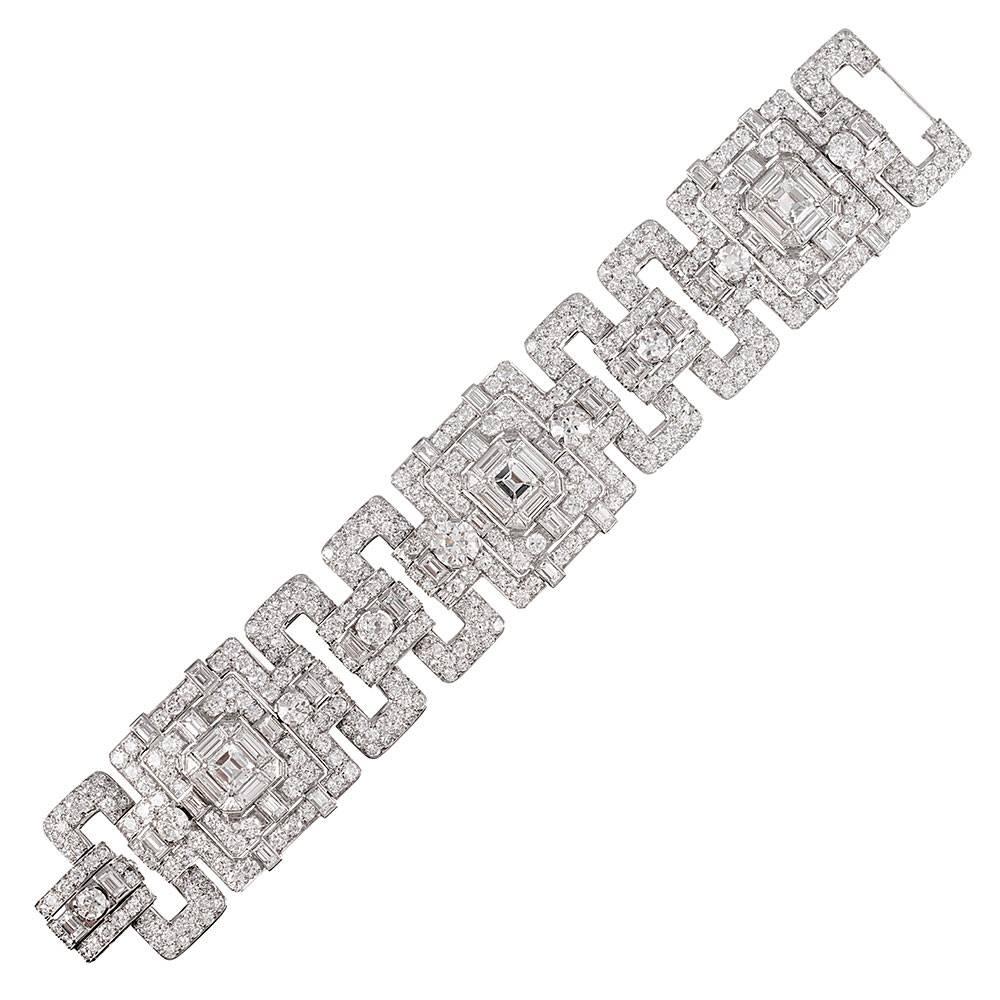 Astounding, glamorous and important, this beautiful art deco diamond bracelet is among the finest we have seen. Crafted by hand in platinum, this creation combines mixed shapes of brilliant white diamonds into a master piece of art deco finery.
