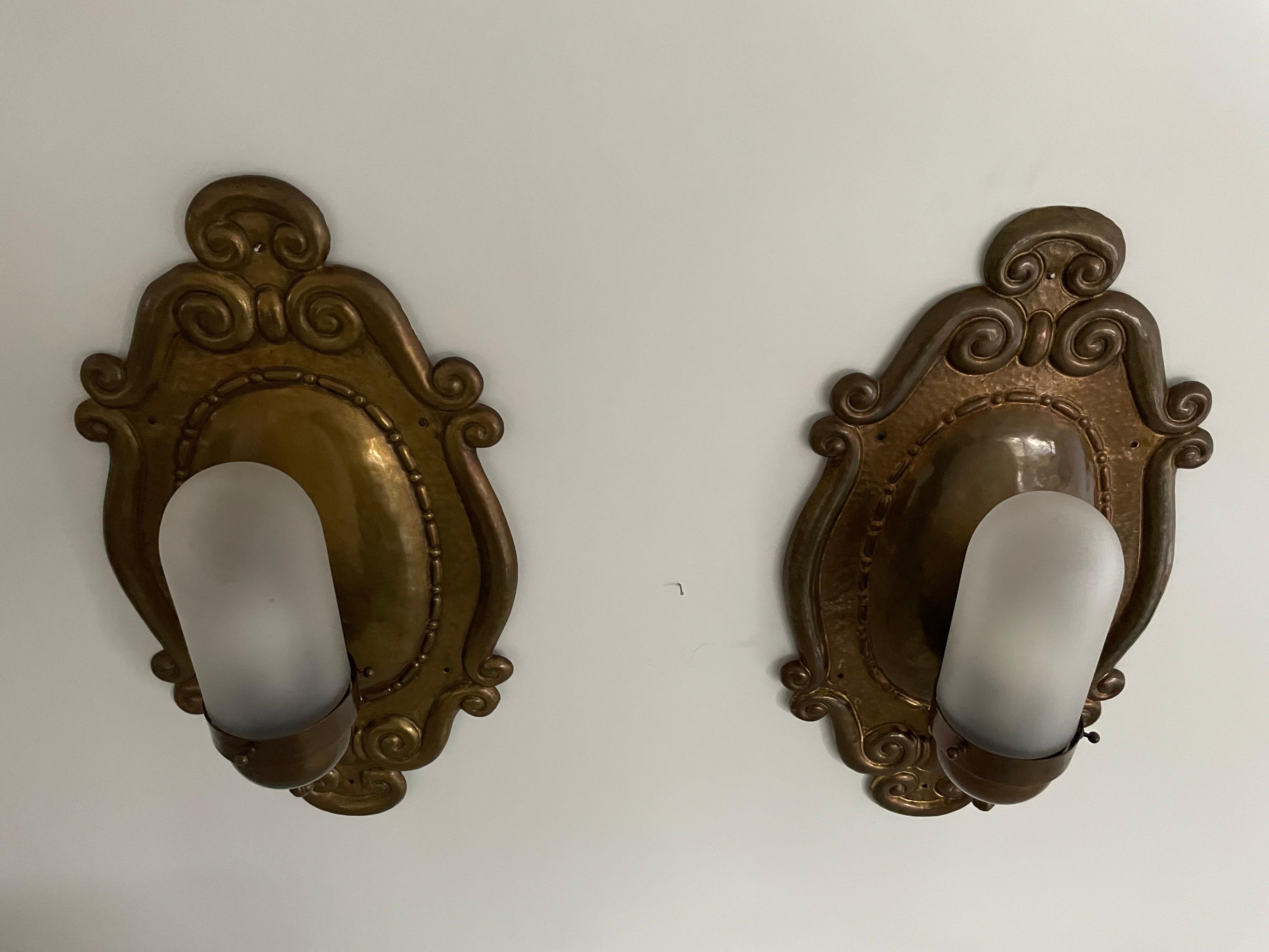 Exceptional Art Deco Glass and Copper Body Pair of Sconces, 1940s, Germany

Lamps are in very good condition.

These lamps works with E27 standard light bulbs. 
Wired and suitable to use in all countries. (110-220 V)

Dimensions:
Height: 58