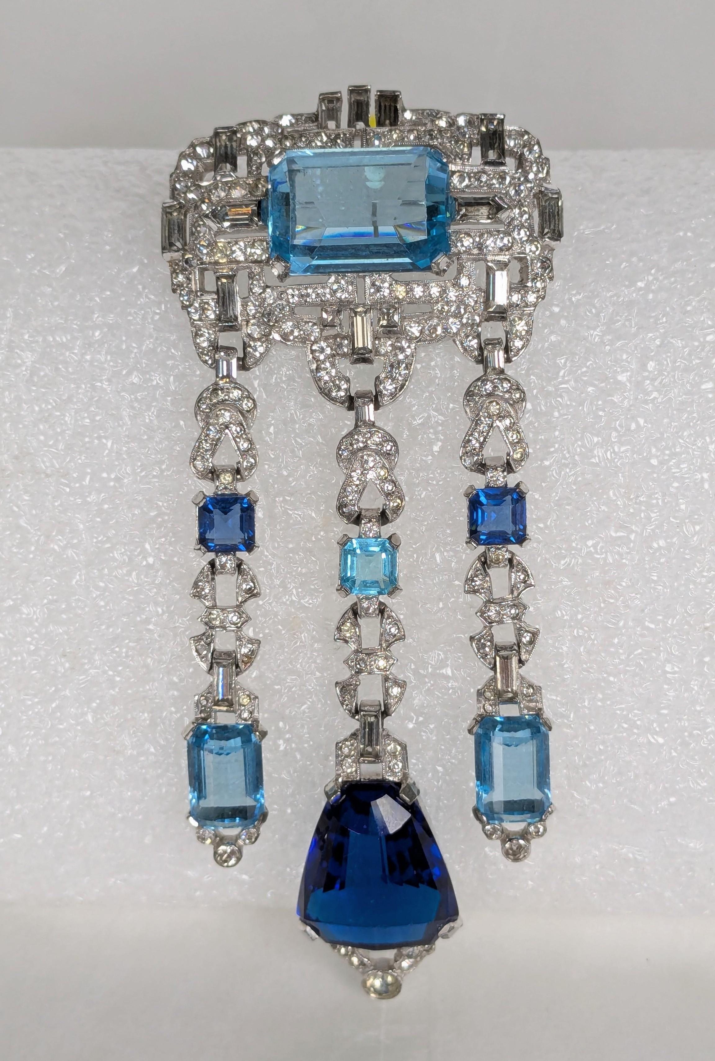 Exceptional Art Deco Mazer Pendant Brooch from the 1930's. High Art Deco design with step faceted faux aquamarines and sapphires set within an intricate pave and baguette dangle setting. 1930's USA, Unsigned. 4