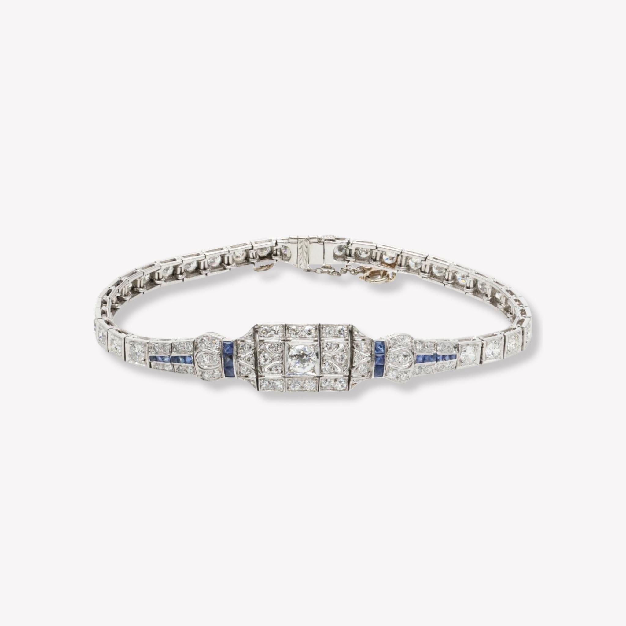 Exceptional Art Deco Platinum, Diamond, and Sapphire Bracelet 

Immerse yourself in the opulence of the Art Deco era with this extraordinary bracelet, crafted in luxurious platinum and adorned with a stunning array of diamonds and sapphires. With