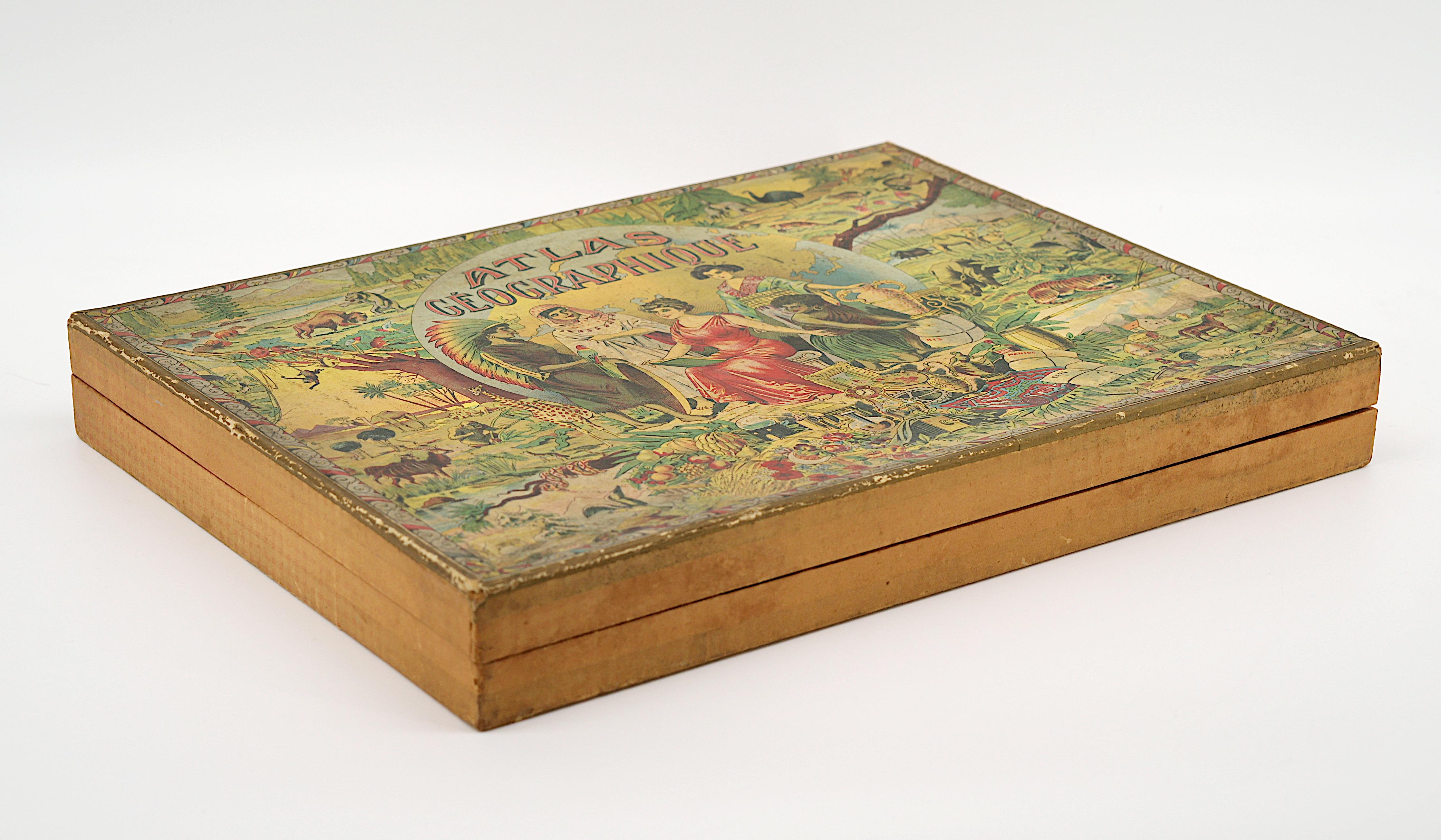 Puzzle d'atlas français édité par Léon Saussine, France, vers 1900. Puzzle exceptionnel composé de 7 planches intitulées Mappemonde, France par départements, Europe, Amérique, Afrique, Asie et Océanie. Chaque puzzle repose sur une feuille cartonnée