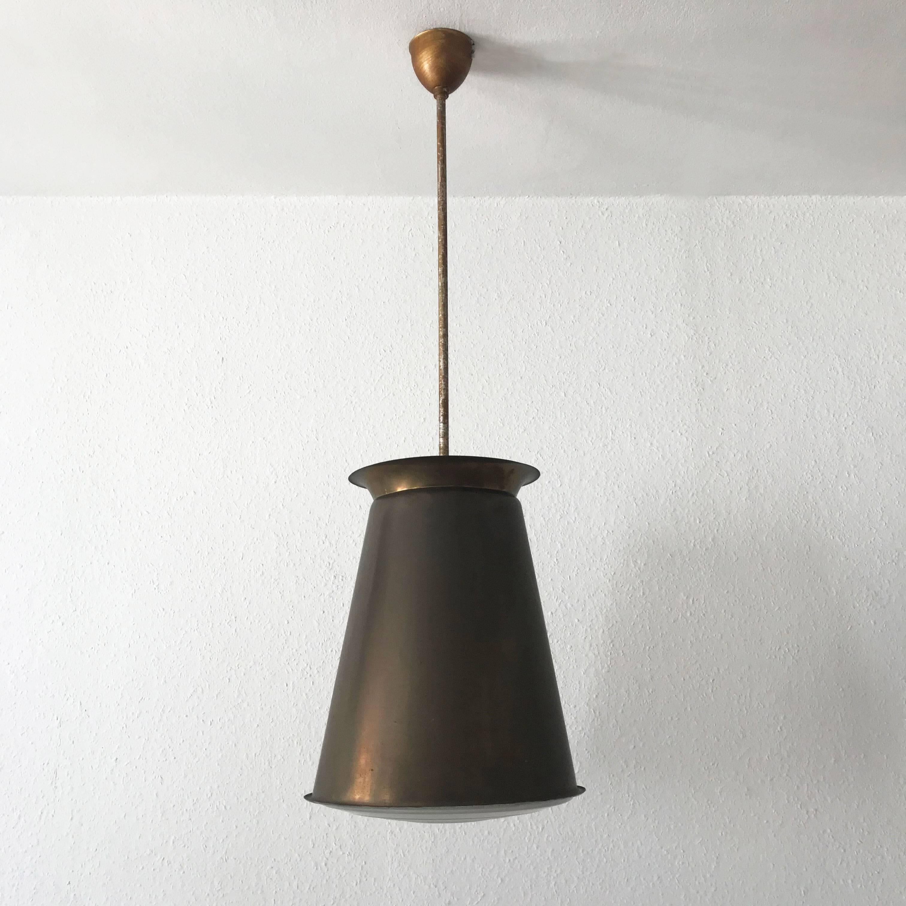 Unique Bauhaus or Modernist pendant lamps. Designed by Adolf Meyer in 1920s and manufactured by Zeiss Ikon, in 1920s-1930s, Germany.
On one of the glass shades is the mark of the maker most visible: ZEISS IKON. JZ 51 NR.1 C7 (see the last