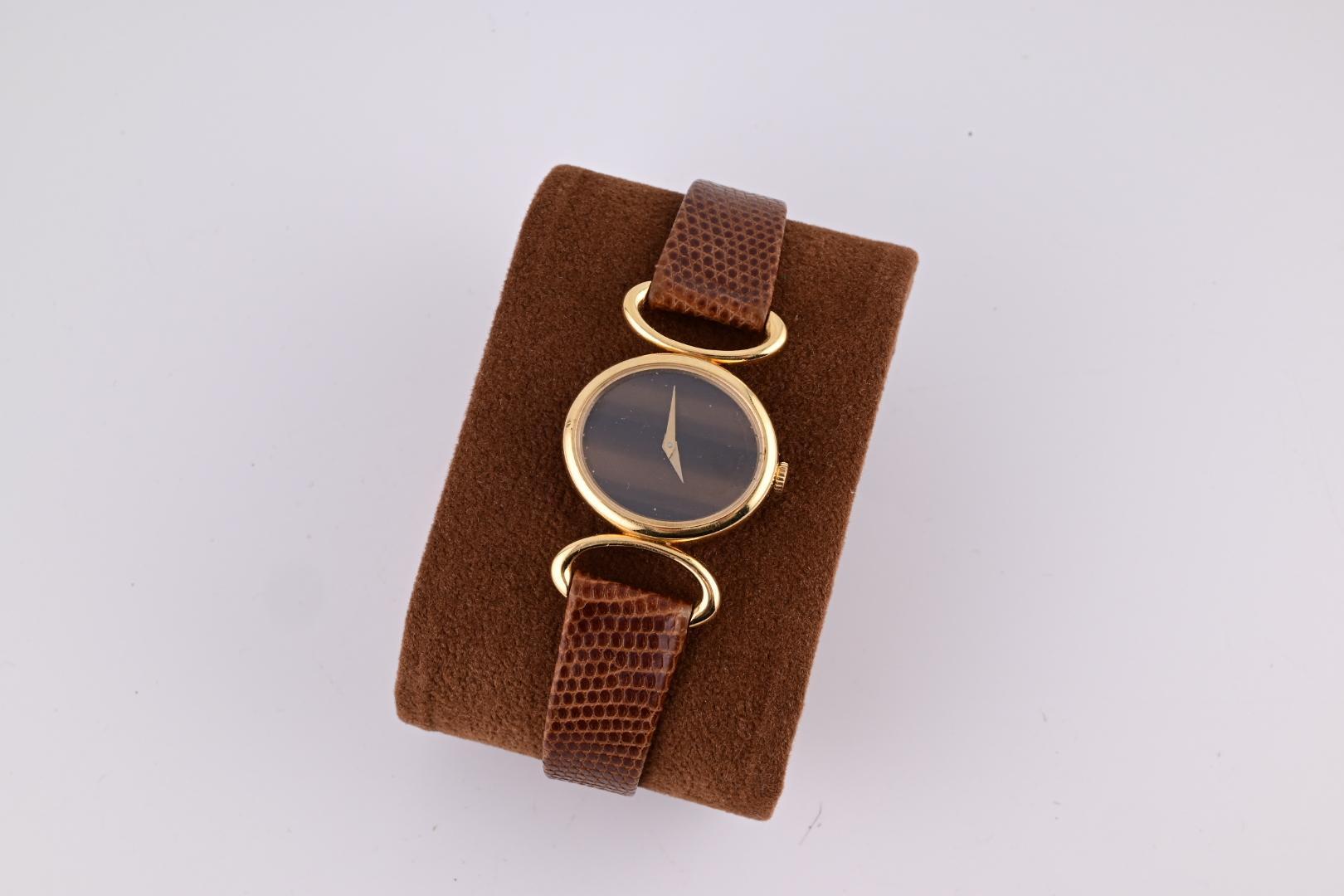 Exceptionnelle montre-bracelet Baume Mercier pour femmes avec cadran œil de tigre en or jaune 18 carats Pour femmes en vente