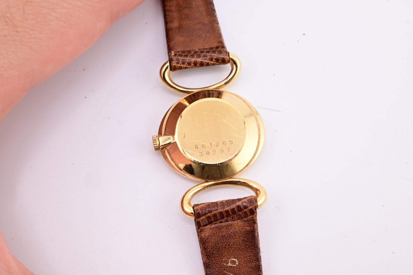 Exceptionnelle montre-bracelet Baume Mercier pour femmes avec cadran œil de tigre en or jaune 18 carats en vente 1