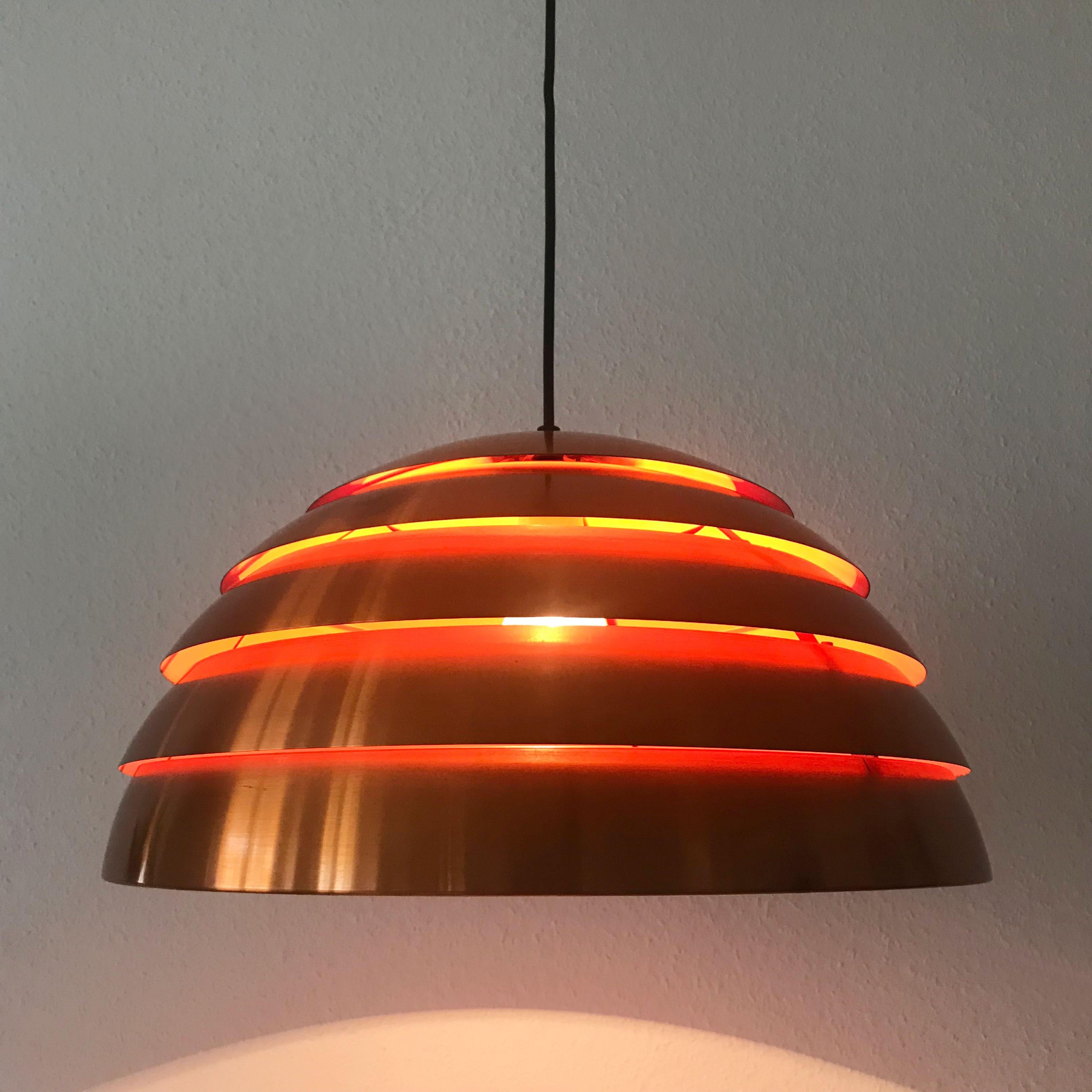 Extremely rare, large Mid-Century Modern copper beehive pendant lamp by Hans-Agne Jakobsson for Hans-Agne Jakobsson AB, company in Markaryd, Sweden, 1960s. 

Executed in copper anodized solid brass sheet. Inside in orange color lacquered. The lamp