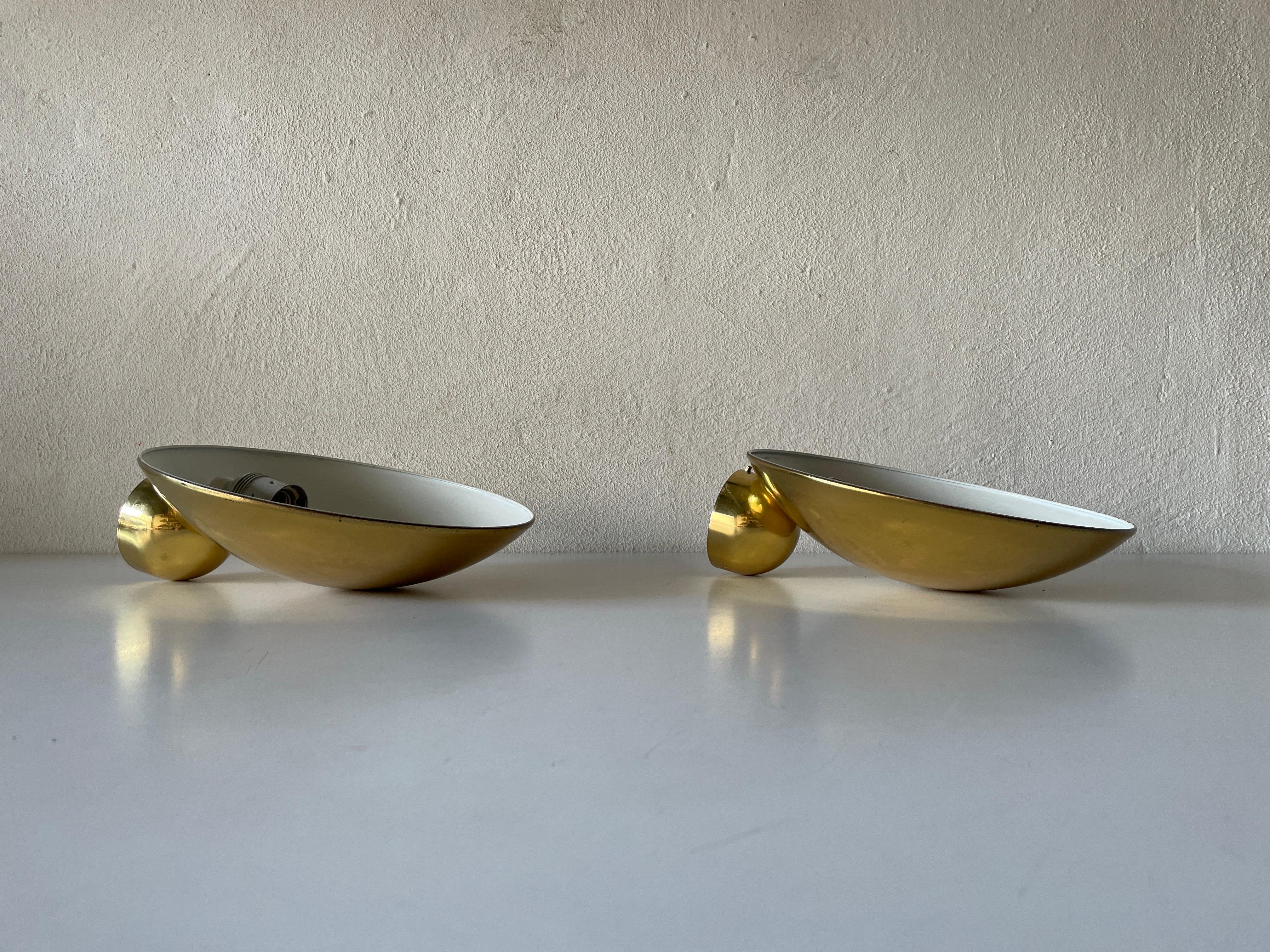 Exceptional Brass Pair of Sconces by Hustadt Leuchten, 1960s, Germany

Very elegant and Minimalist wall lamps.
Lamp is in very good condition.

These lamps works with E27 standard light bulbs. 
Wired and suitable to use in all countries. (110-220