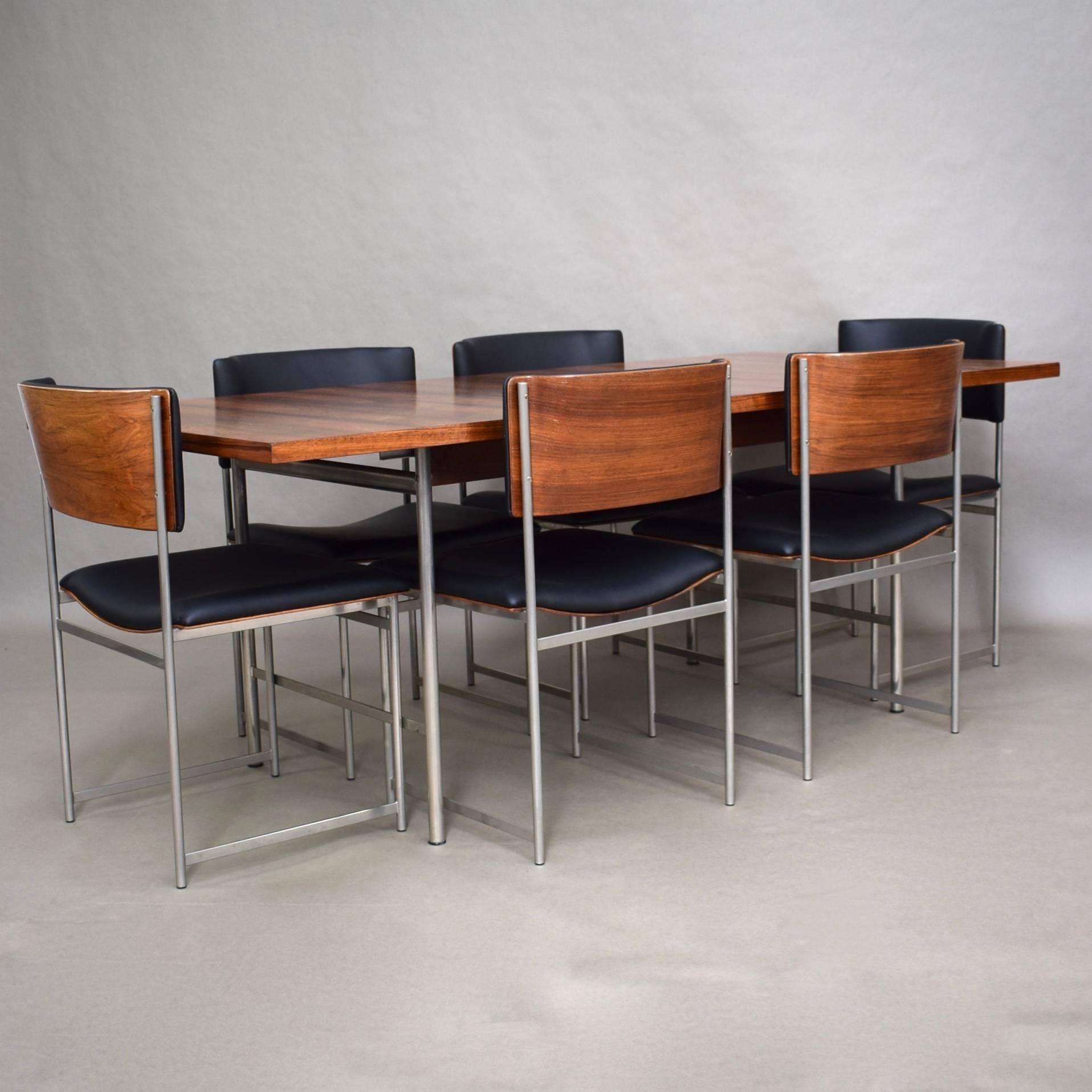 Gorgeous and rare Brazilian rosewood (Rio palissander) model SM-08 dining set by Cees Braakman.
The backs and seats are made of Brazilian rosewood molded plywood.
The table top and plywood backs have been refinished. The chairs have been