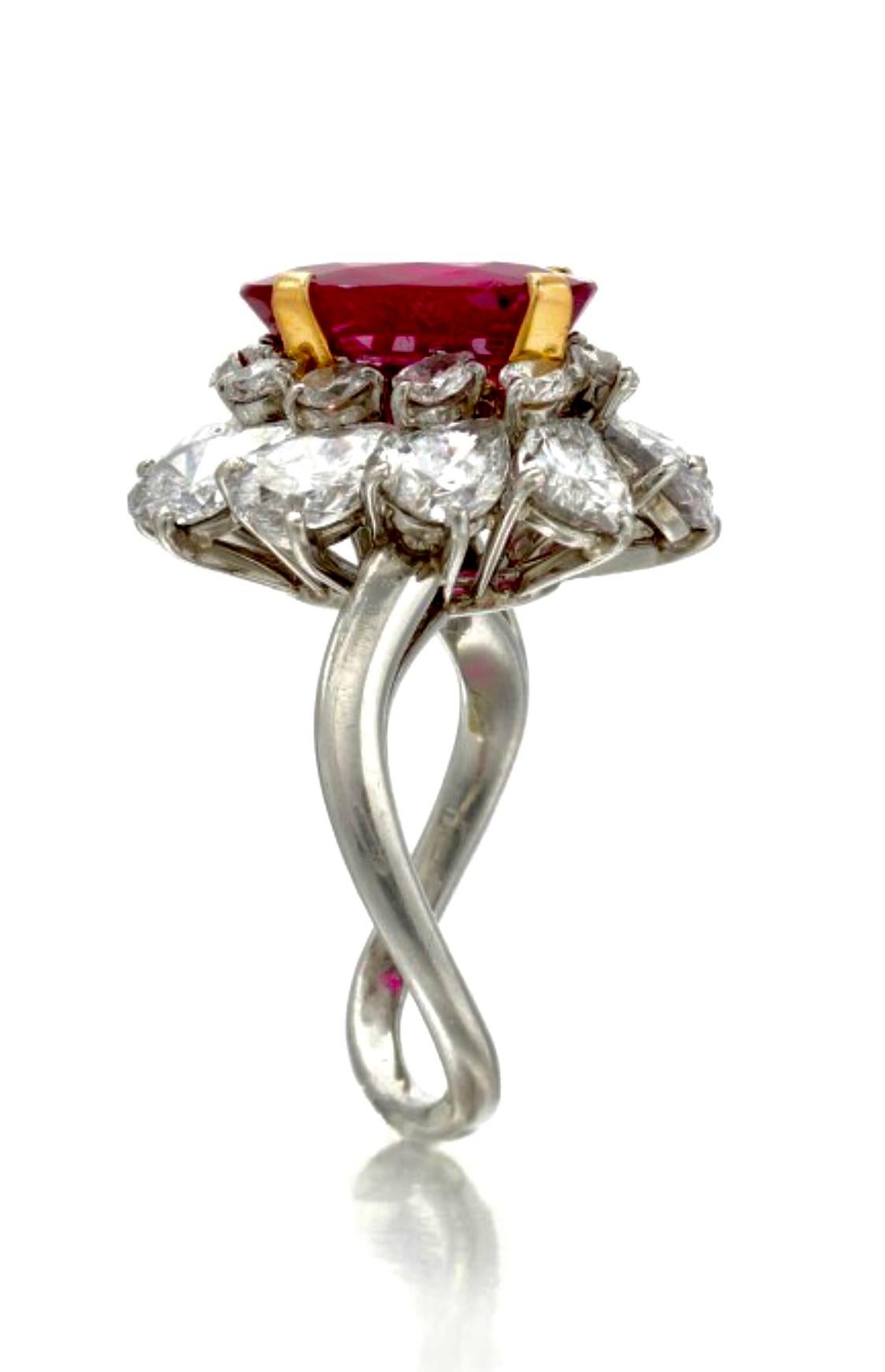 Exceptional Bulgari Burmese ruby and diamond 'Ballerina' ring. An important piece, set to centre with a Oval shape old cut natural unenhanced Burmese ruby, with an approximate weight of 3,67 carats in a stunning Platinum setting, flanked by 20