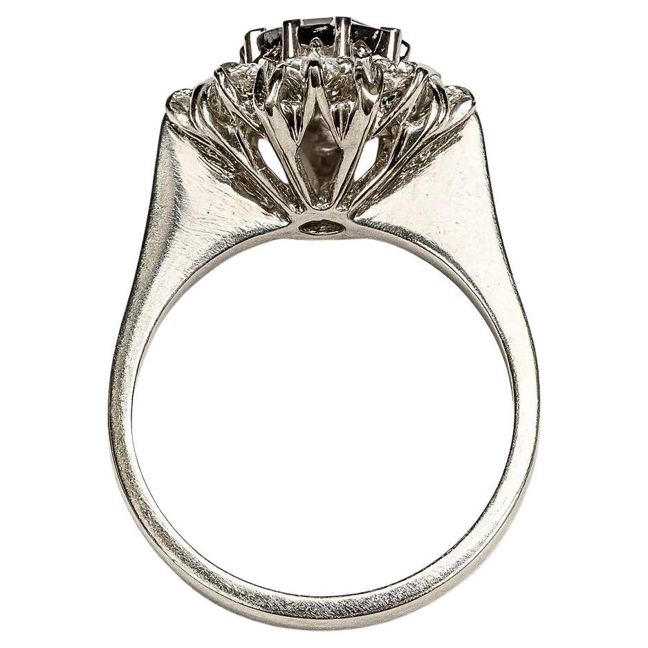 Exceptional Burma Sapphire & Diamond Cluster Ring – Unheated Royal Blue Mogok Sapphire

This spectacular cluster ring showcases a rare natural, unheated Royal Blue Burma (Myanmar) Mogok sapphire of exceptional quality. The oval-cut sapphire weighs